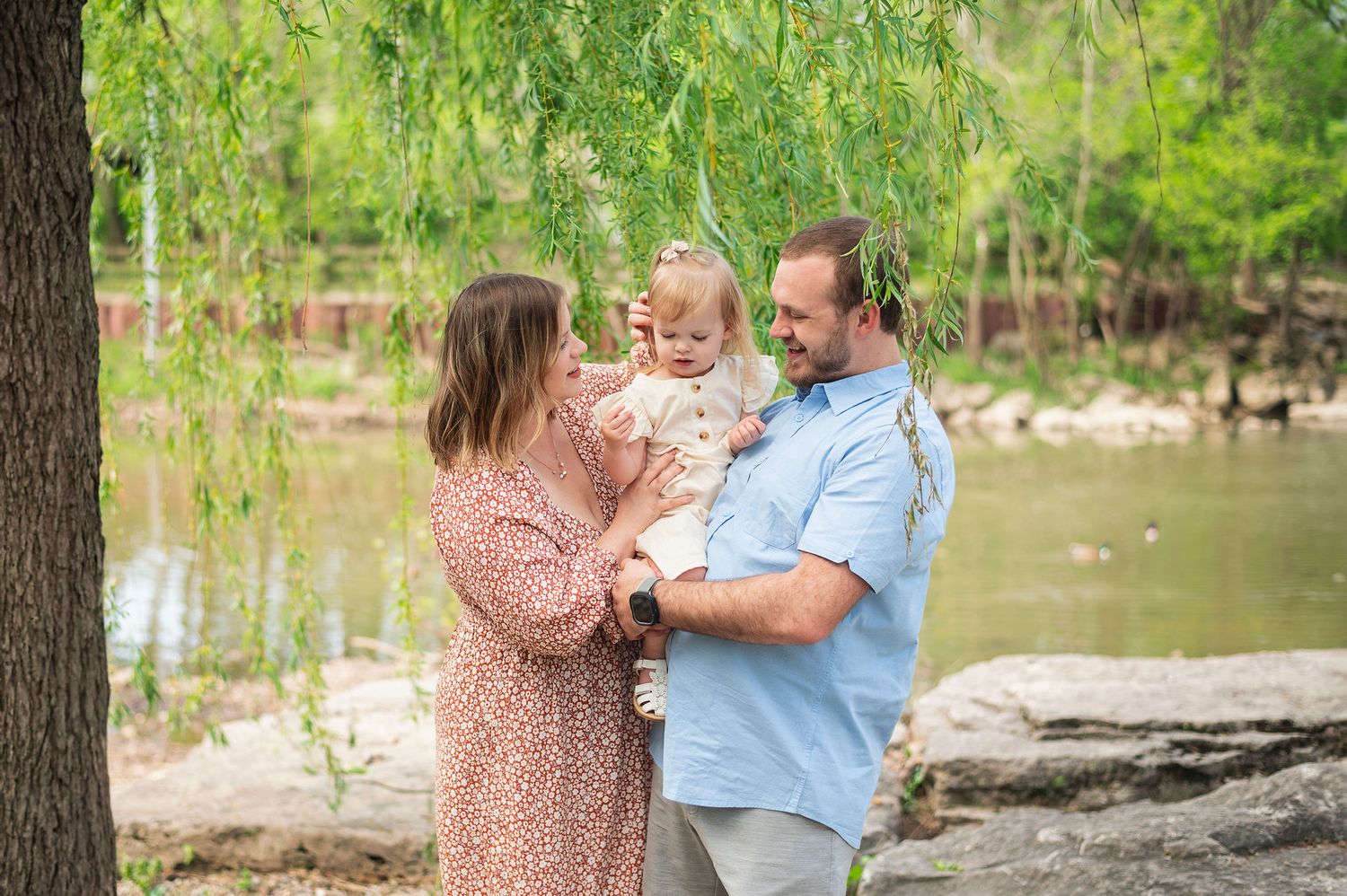 A quiet moment by the water with their curious toddler. Gahanna family photos that feel like your real life.