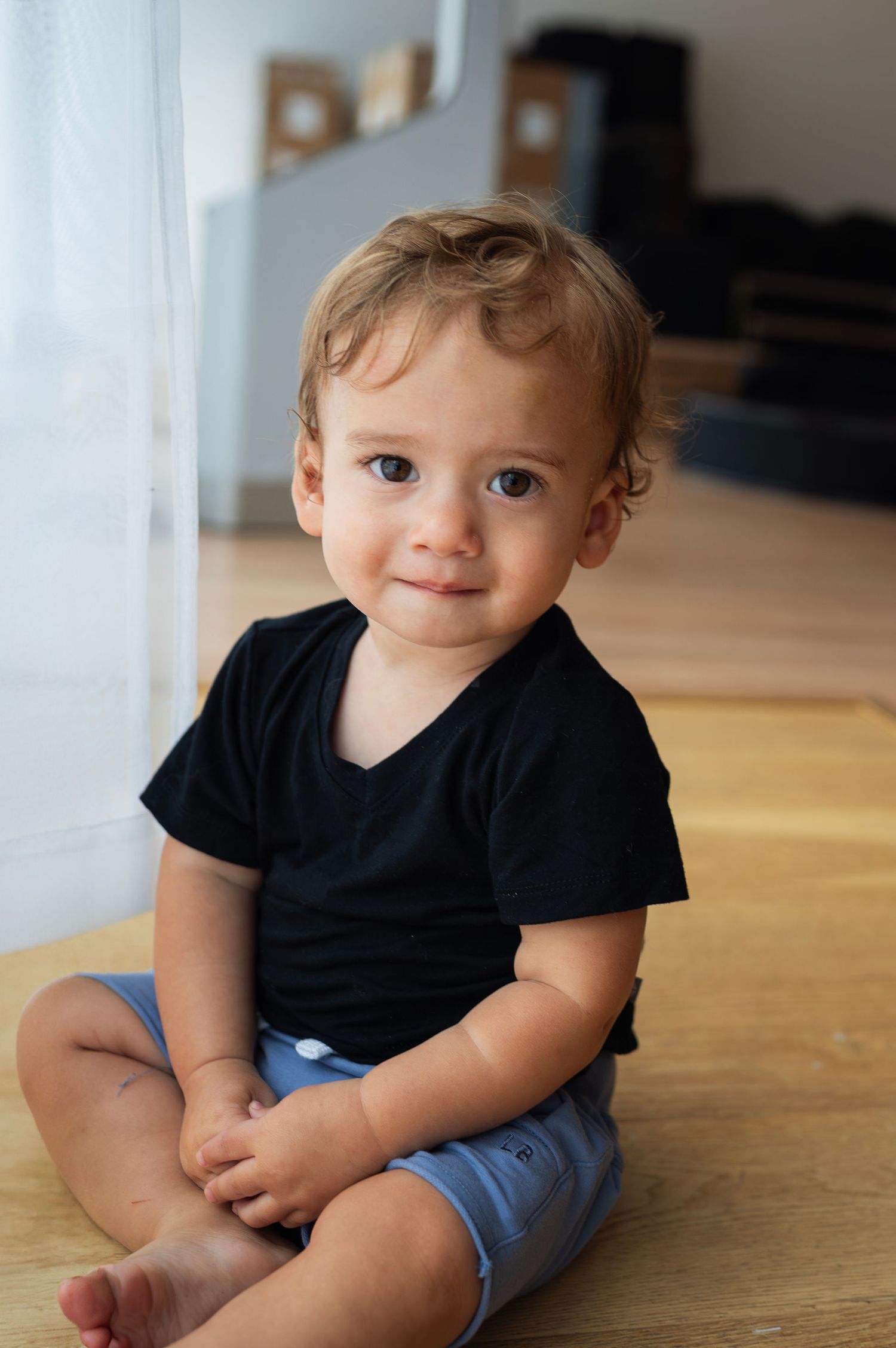 A quiet moment by the window at Curate Studio in New Albany. Milestone sessions like this are a reminder of how quickly the baby grows