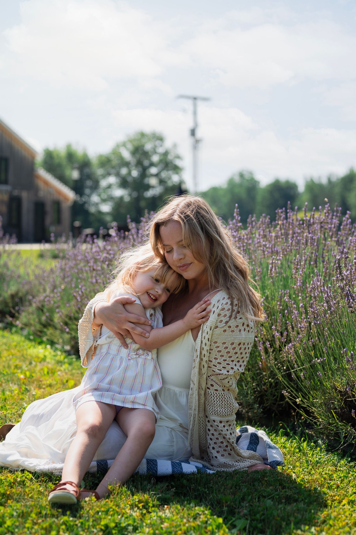 Mother and daughter hugging during a lavender field family session near Columbus, Ohio.