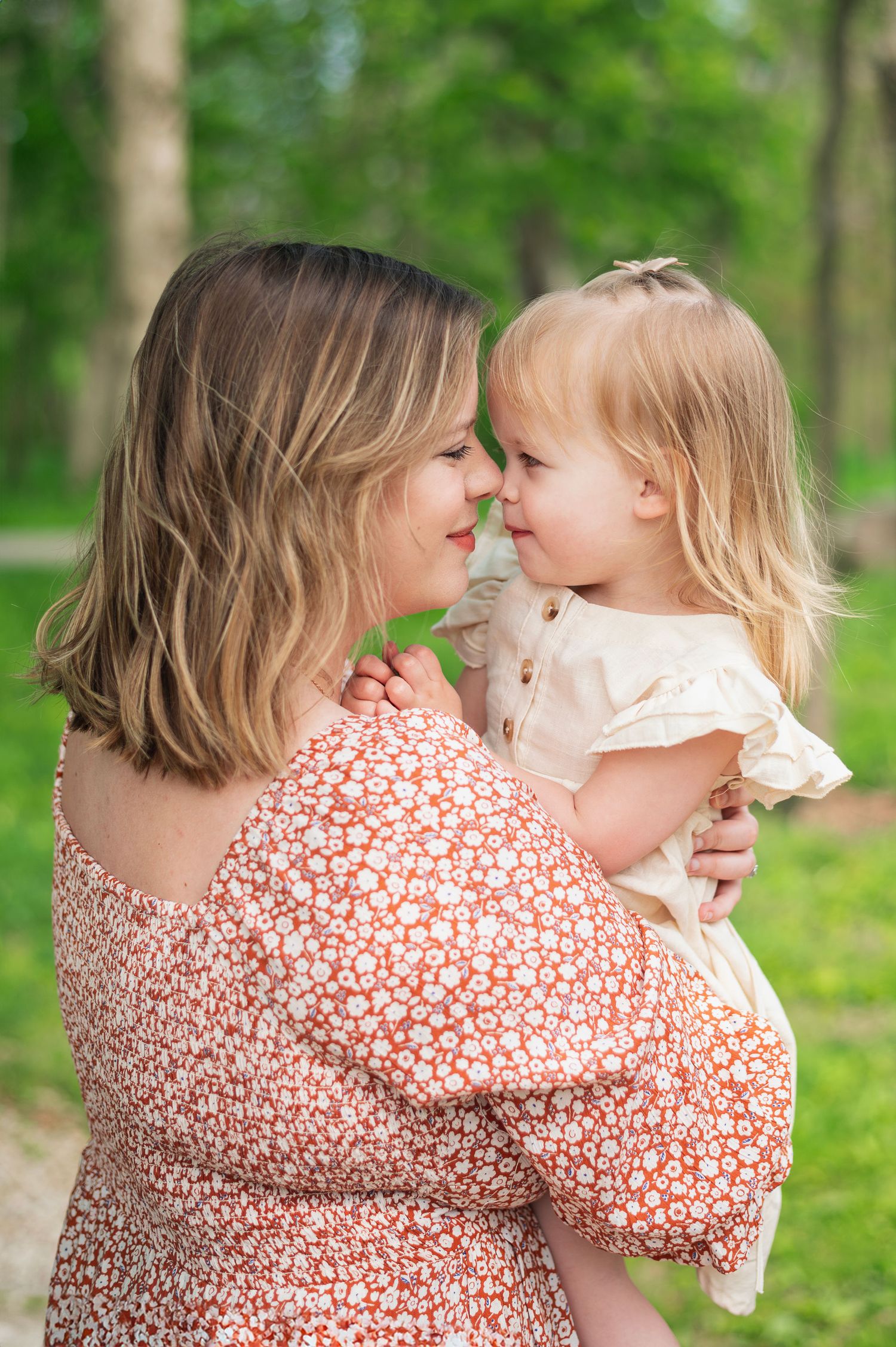 Mom and toddler daughter share a tender nose-to-nose moment during a Gahanna family photo session full of joy and connection.