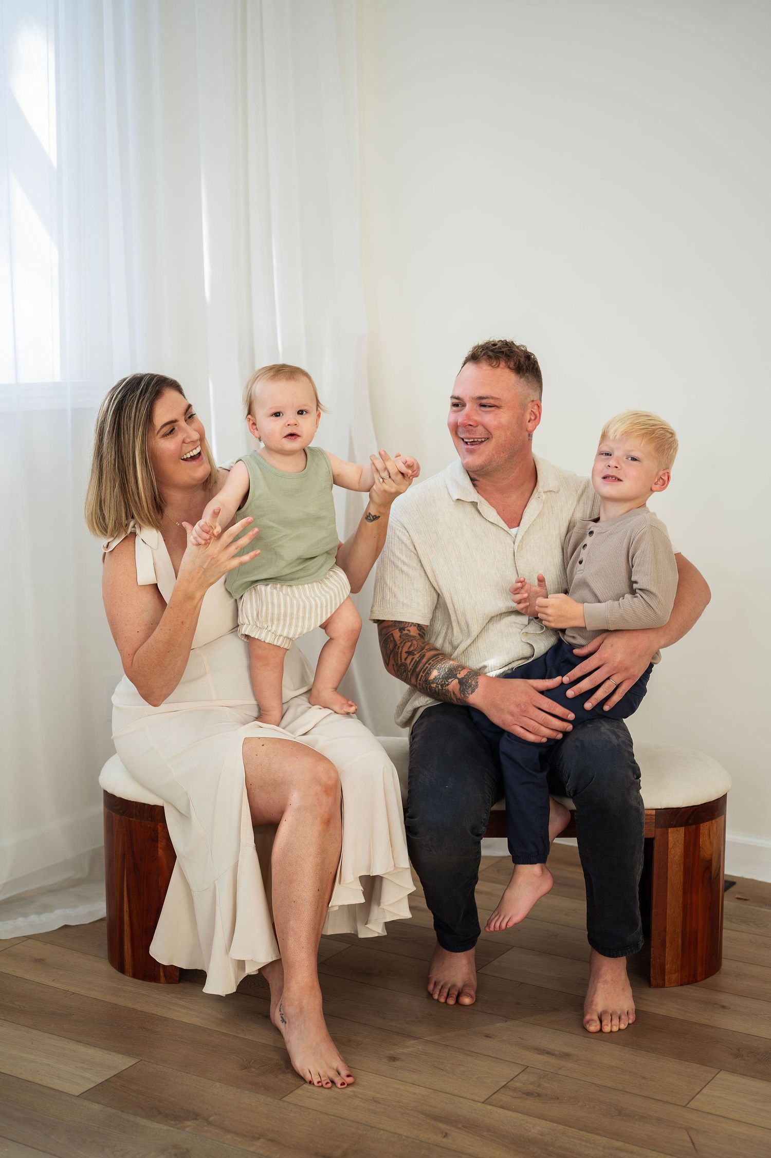 In-studio milestone session with a joyful family of four. Captured by a Westerville family photographer