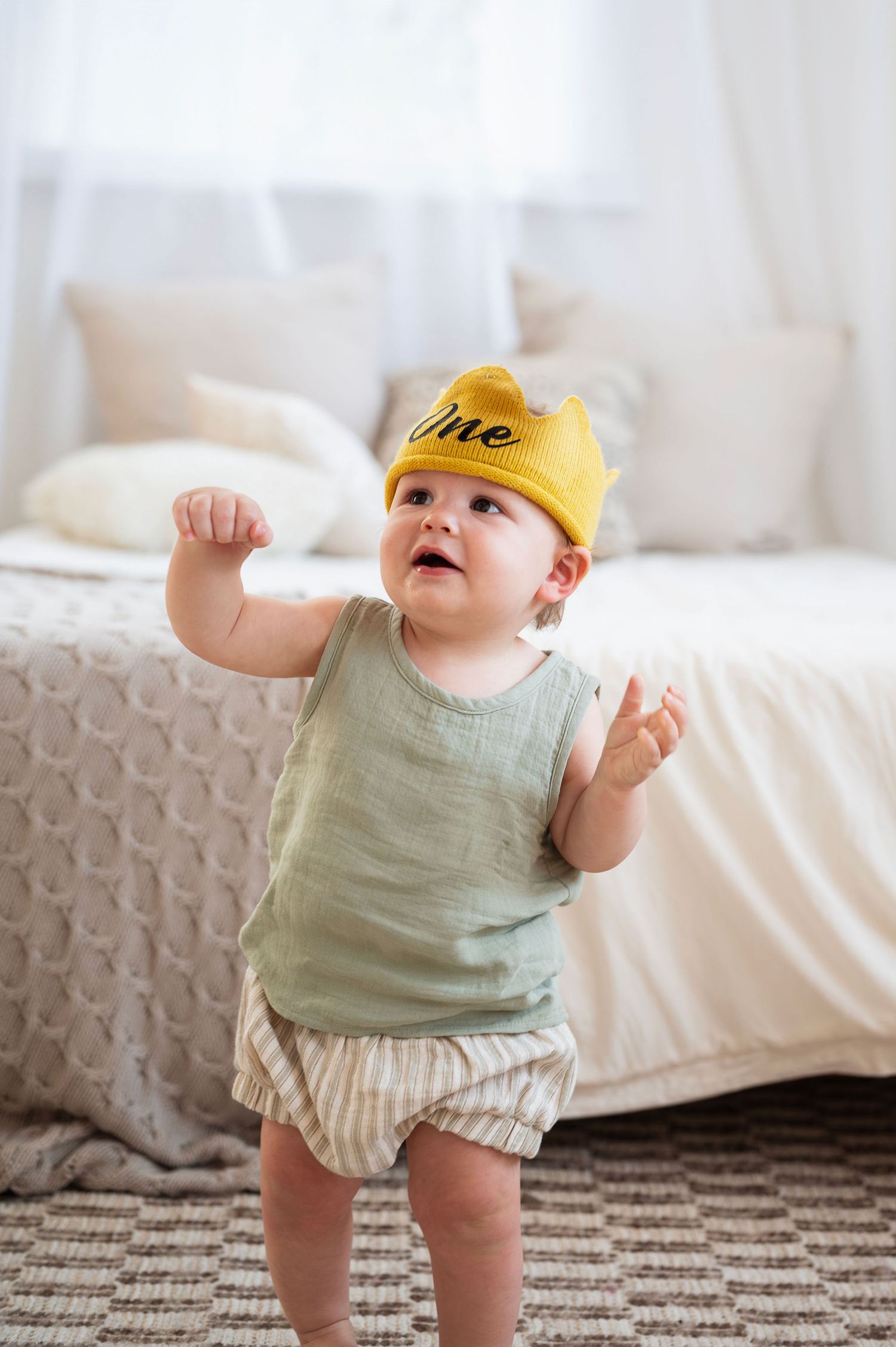 Turning one calls for a crown! Milestone sessions celebrate those sweet firsts—walking, clapping, and cake sneaks included.