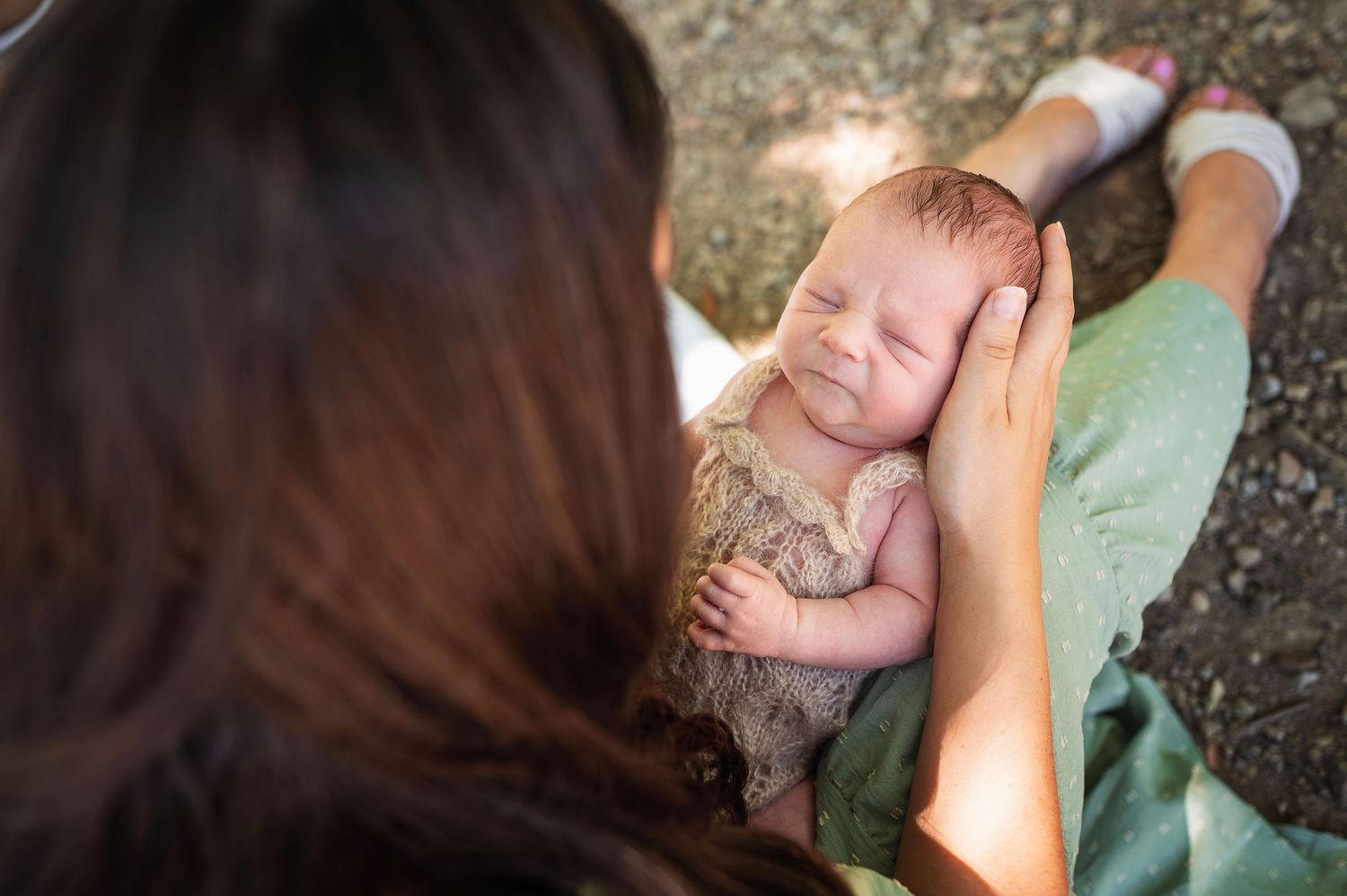Outdoor newborn session with mama holding her baby in natural light. Westerville newborn photographer.