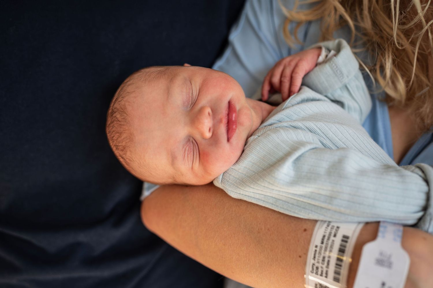 Close-up of newborn sleeping on mom’s chest during Fresh 48 session—Westerville newborn photographer
