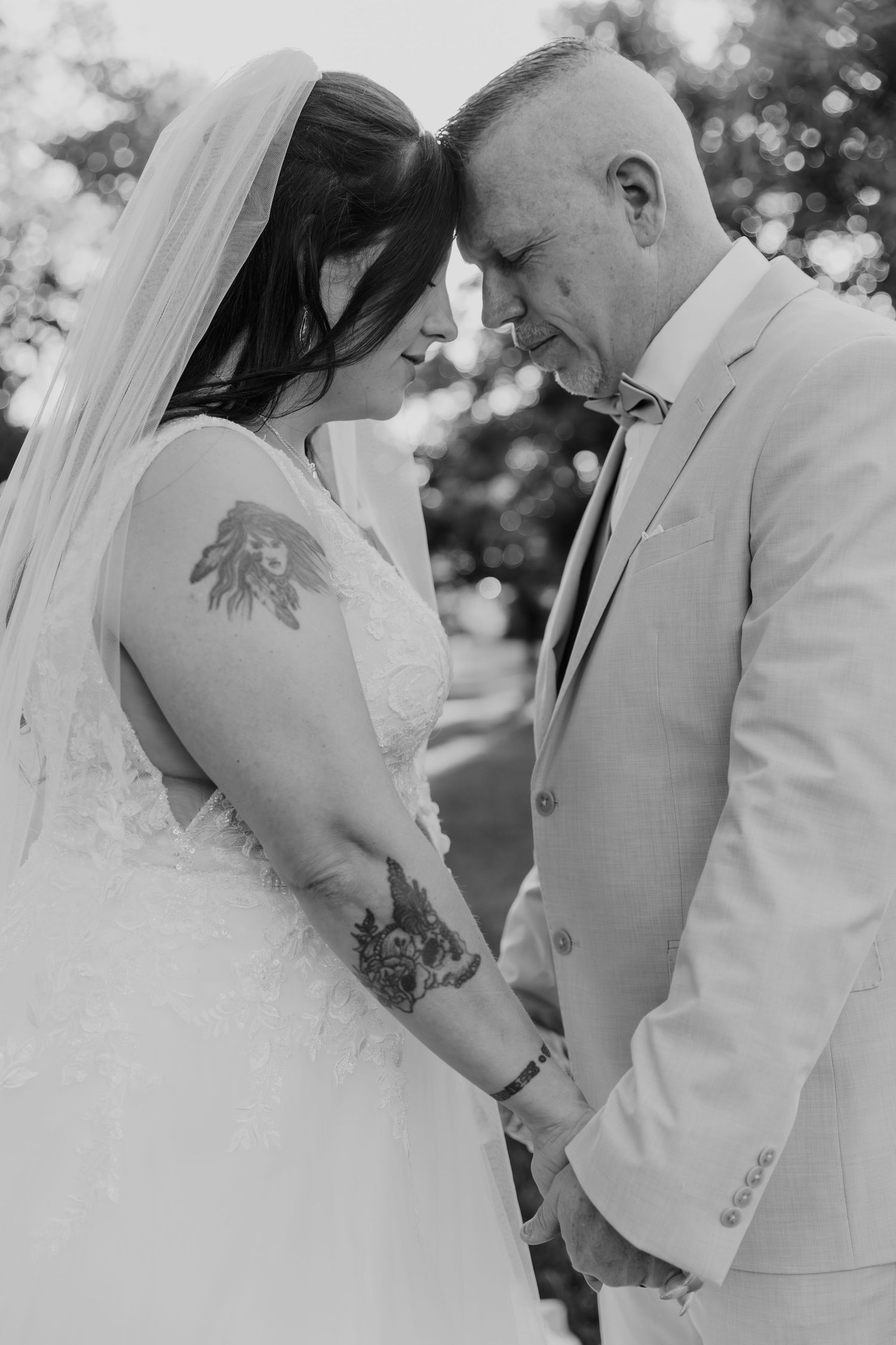 A romantic sequence of a bride and groom sharing intimate moments together in black and white photography.