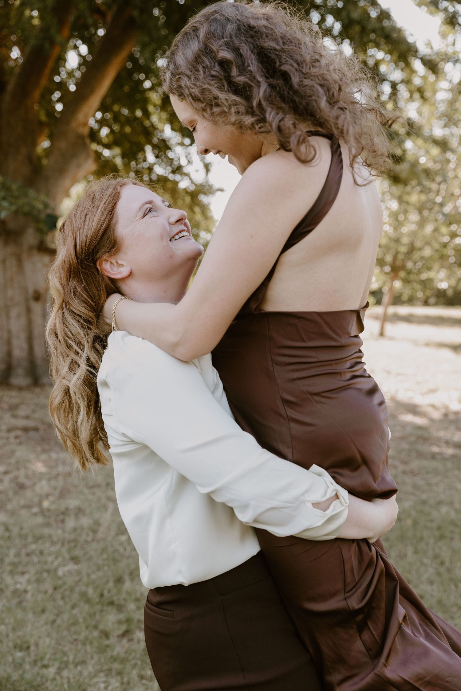Series of joyful outdoor portraits showing two people sharing warm embraces in brown and white attire.