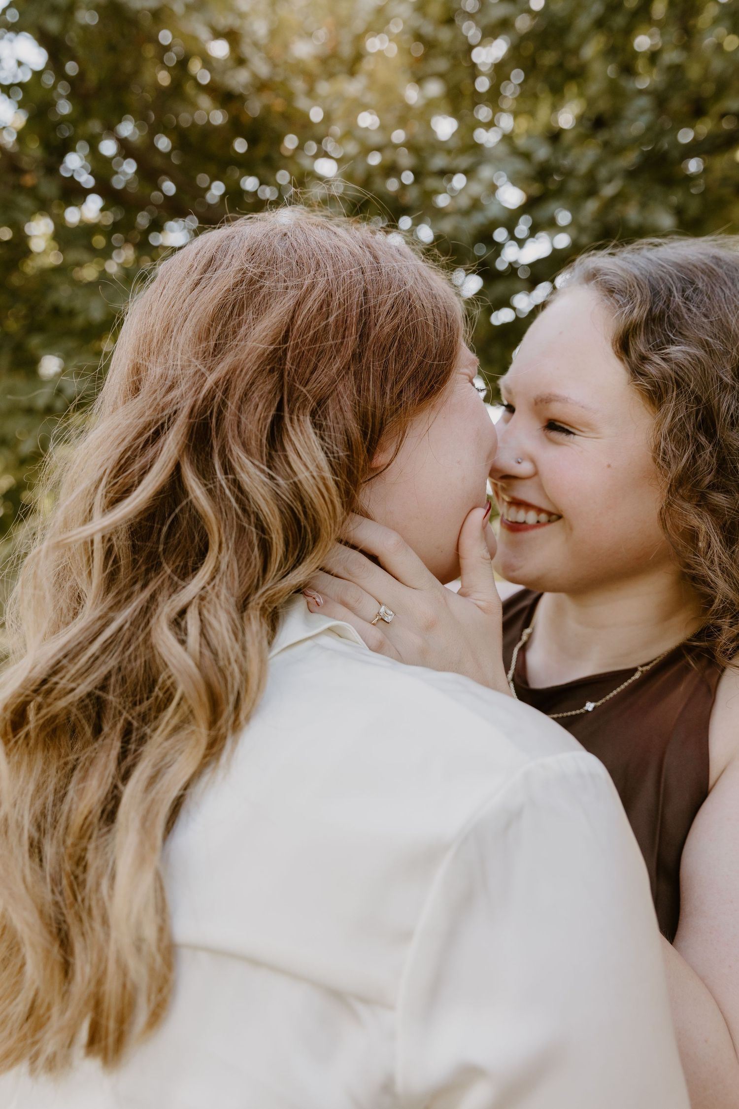 Candid sequence showing a loving embrace between two people against a soft natural backdrop.