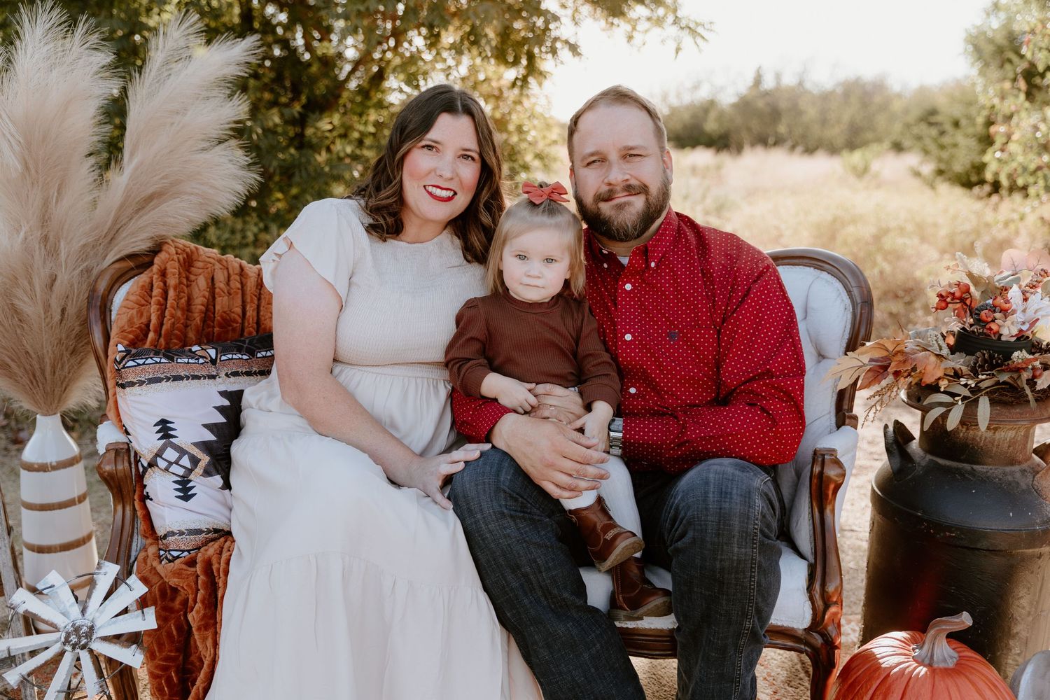 A collage of outdoor family portraits featuring warm autumn colors and coordinated outfits in red and neutral tones.