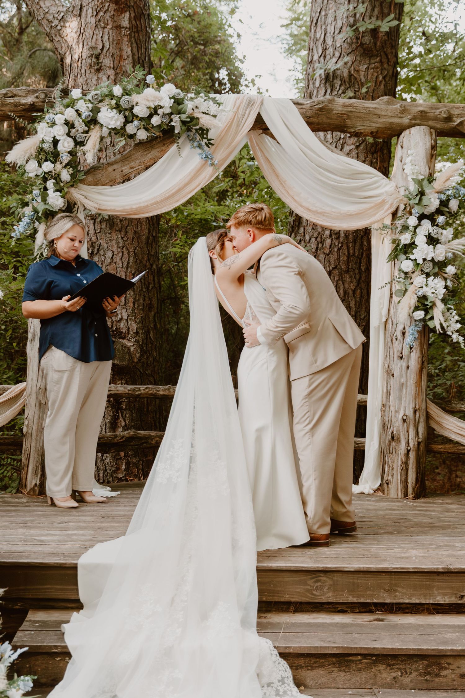 Series of romantic wedding ceremony moments taking place under an elegant outdoor arch with white floral decorations.