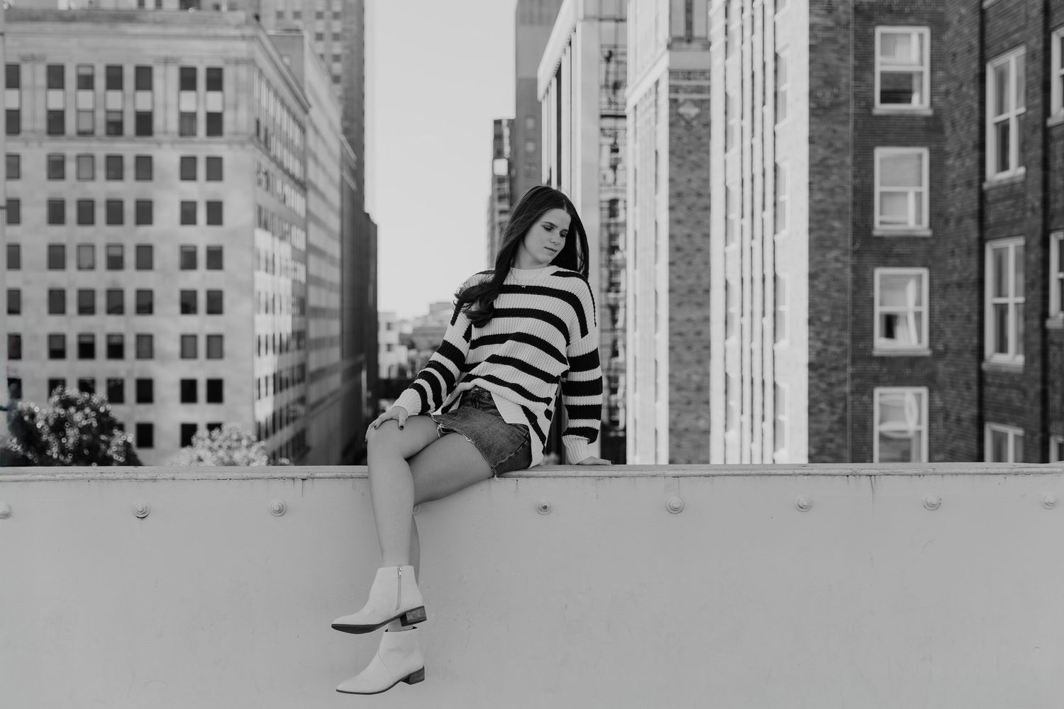 A black and white photo series showing architectural details and urban scenes in a city environment.