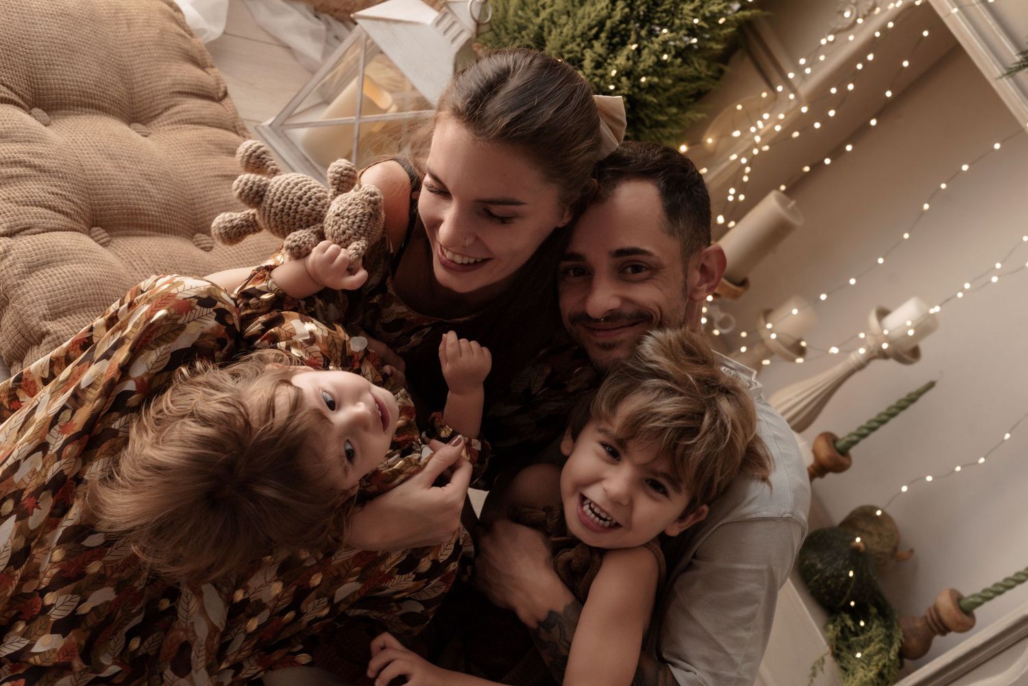 A series of intimate wedding photos showing couples embracing under twinkling lights and greenery decorations.