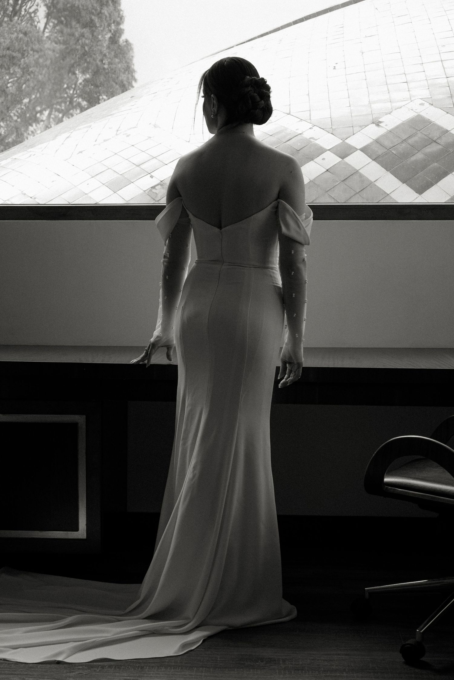 A dramatic black and white photo series showing a person in a flowing white dress sitting at a piano in silhouette.