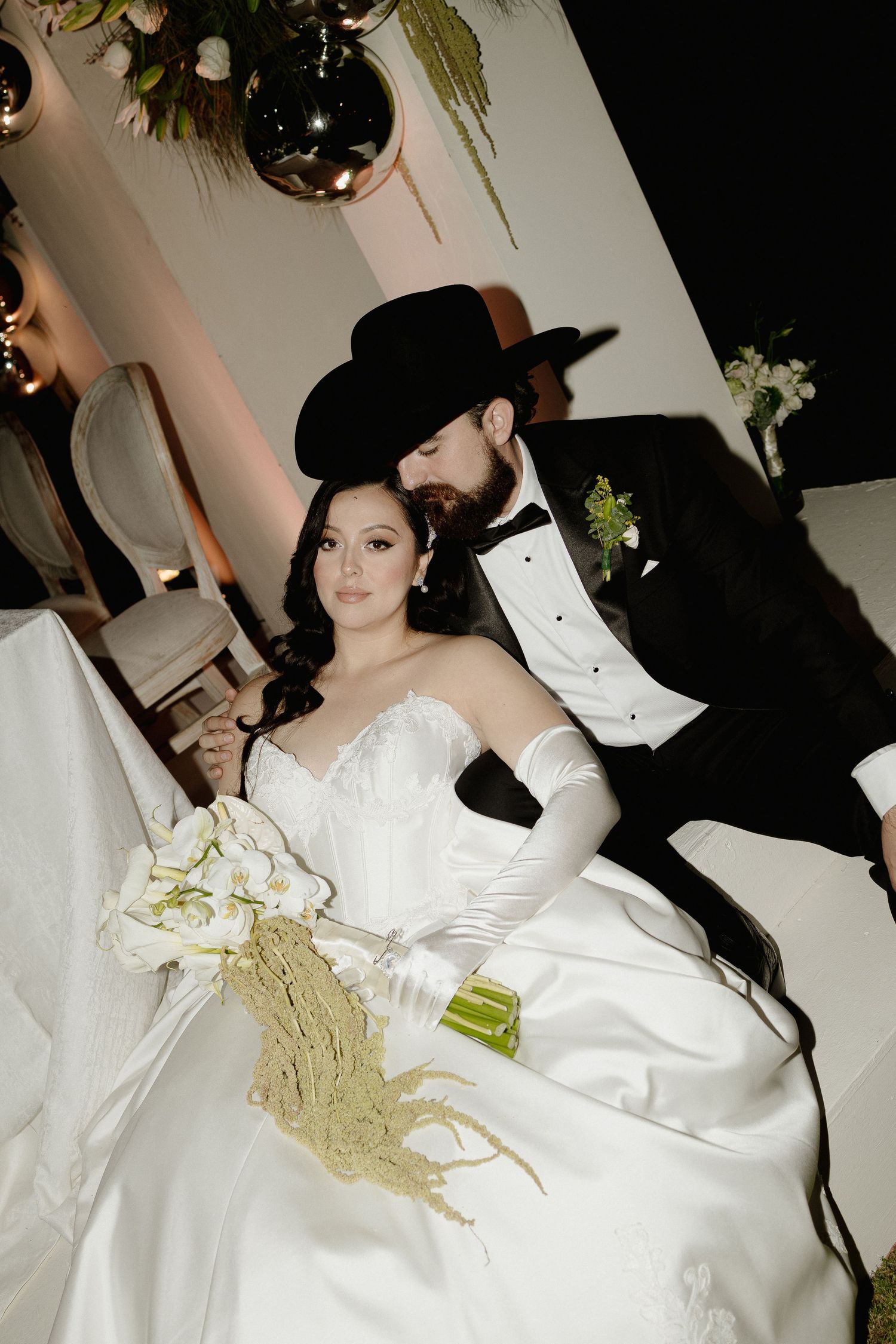 A couple in formal wedding attire, with the bride in white satin and the groom in black, shown in a sequence of photos.