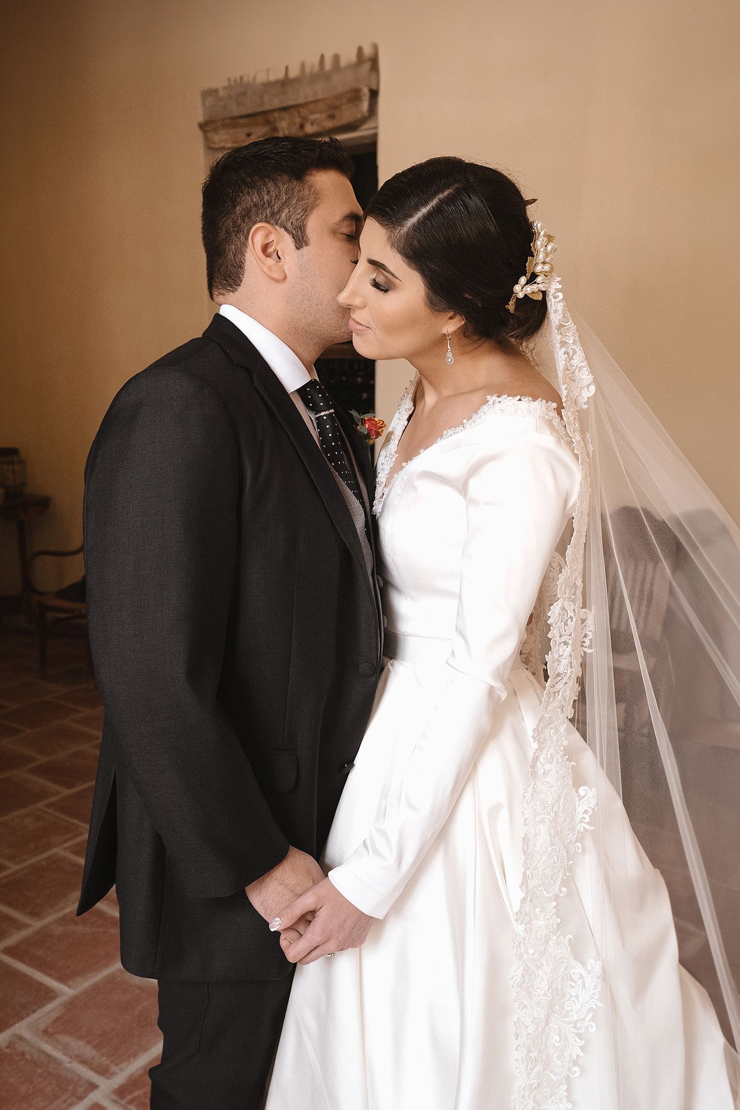 A series of romantic wedding photos showing tender moments between a bride in white and groom in black.
