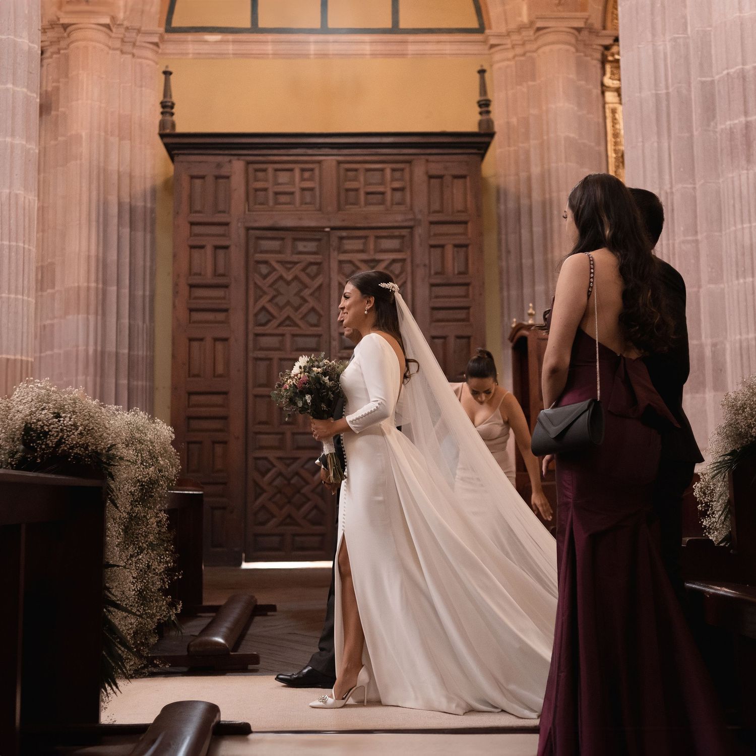 A sequence of wedding photos showing a flowing white veil against ornate wooden church doors and columns.