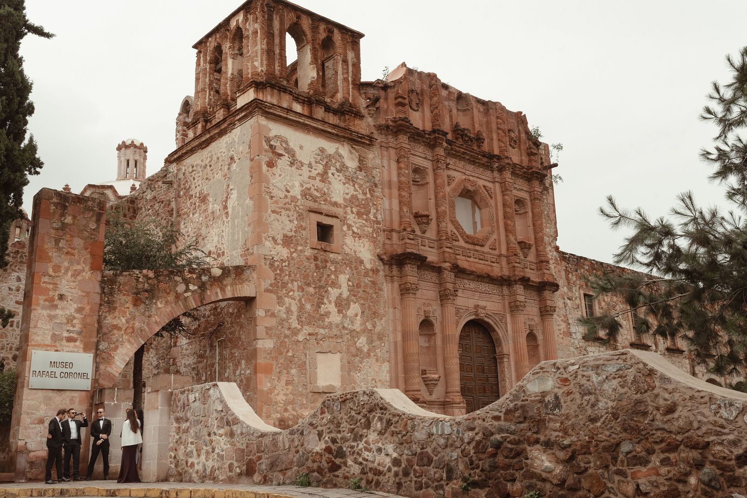 Weathered facade of an old colonial church with rustic stone architecture.