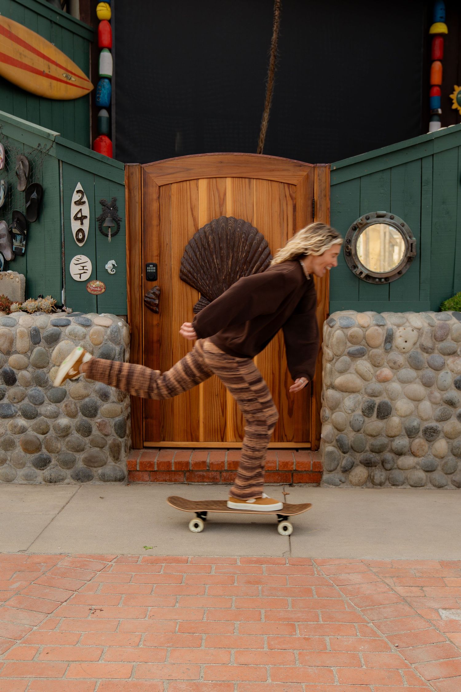 Girl skating in Volcom apparel, showcasing bold style and dynamic movement on a sunny day.