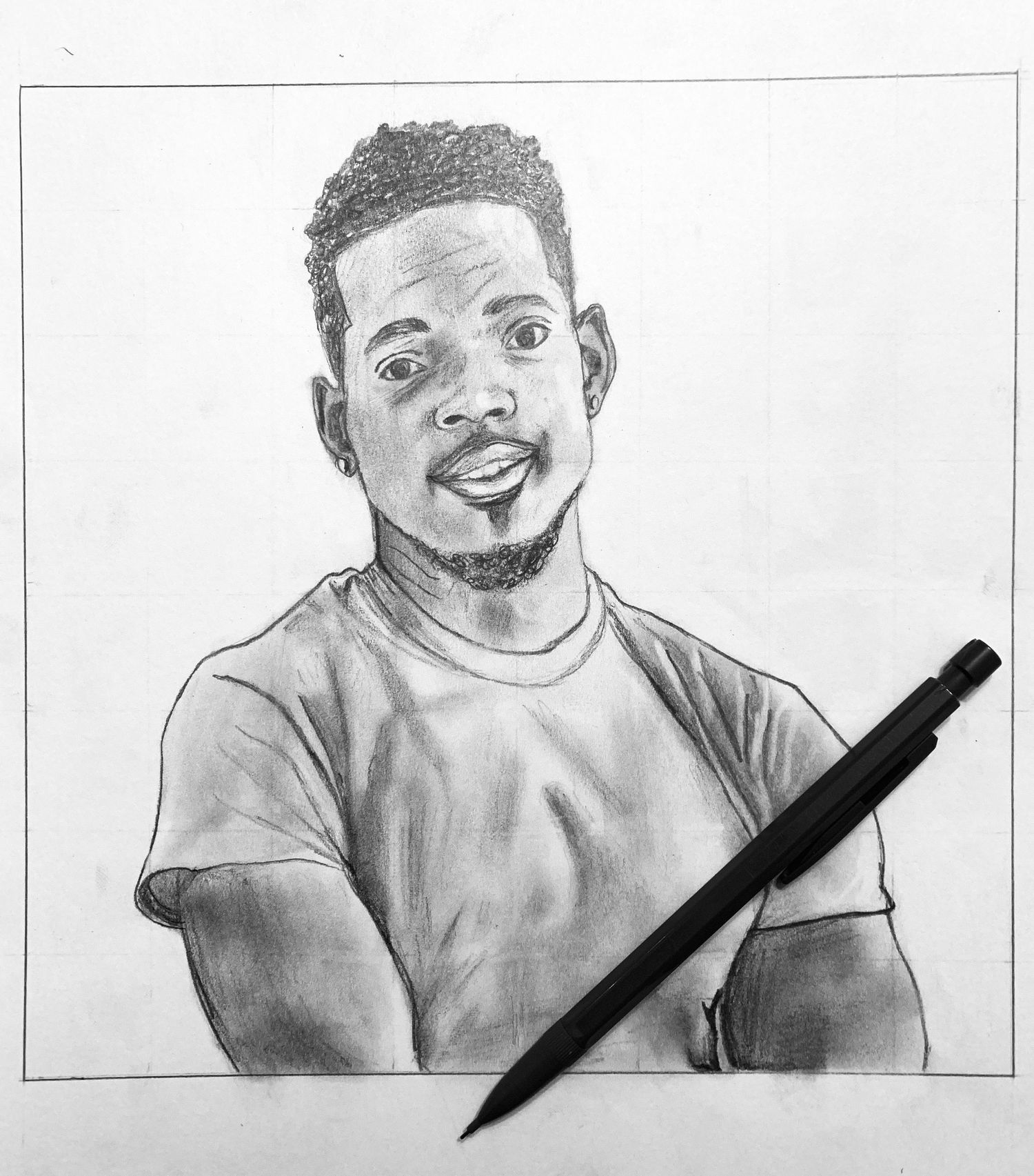 A detailed pencil sketch drawing showing a joyful expression, with a drawing pencil placed at the bottom of the artwork.