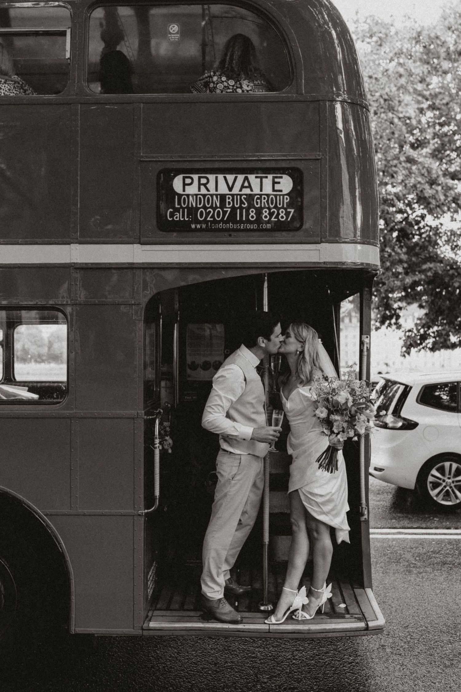Vintage black and white sequence showing people boarding a private bus service in the 1950s.