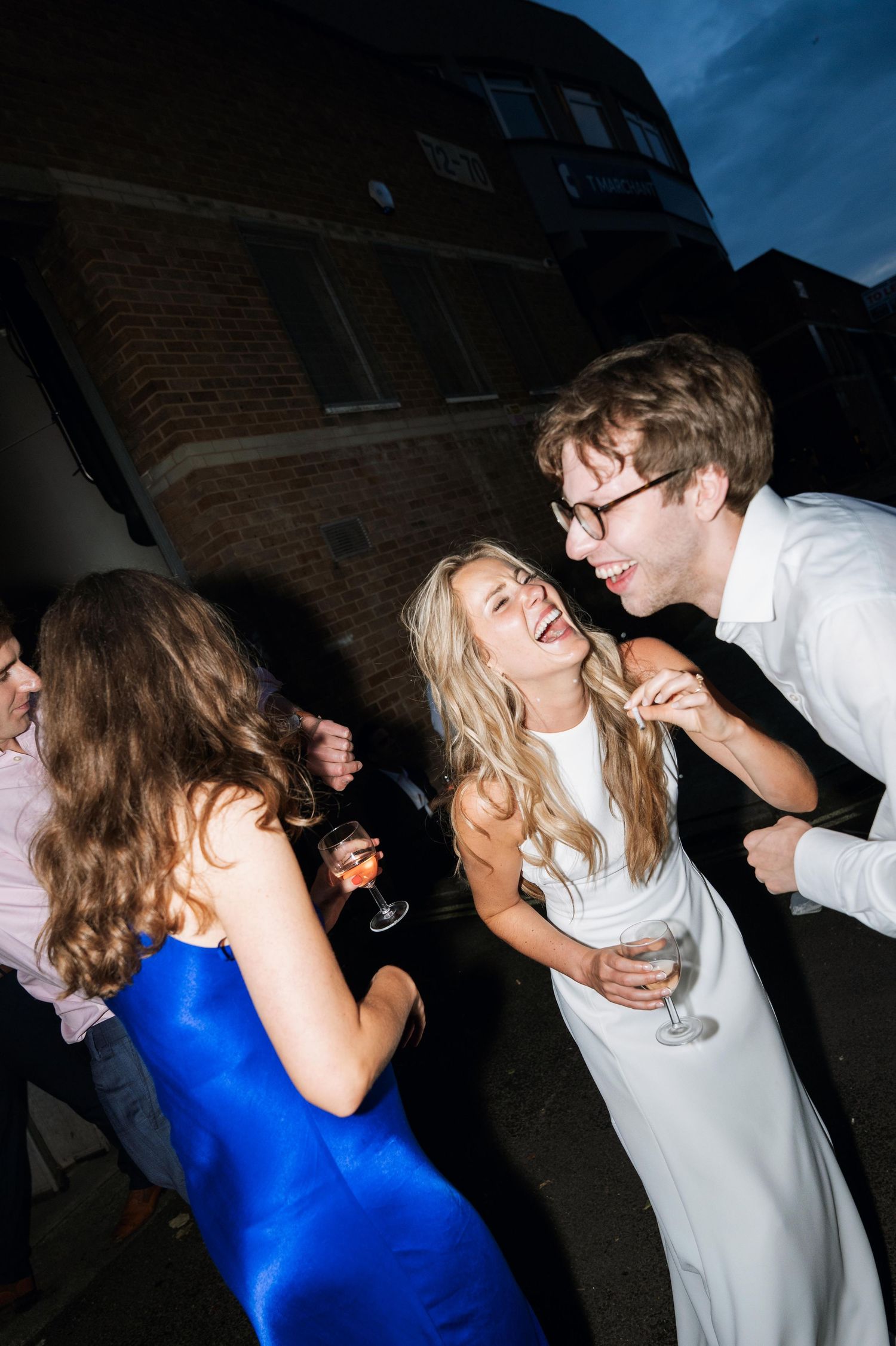A sequence of photos showing people dancing and laughing at a party with blue lighting and festive atmosphere.