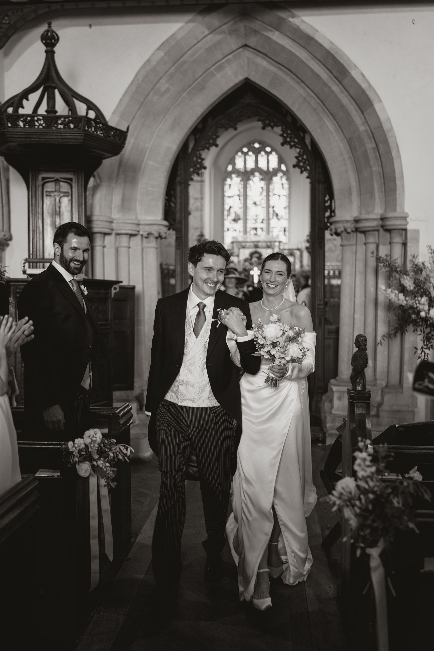 Five black and white vintage photographs showing a wedding celebration sequence in a church archway.