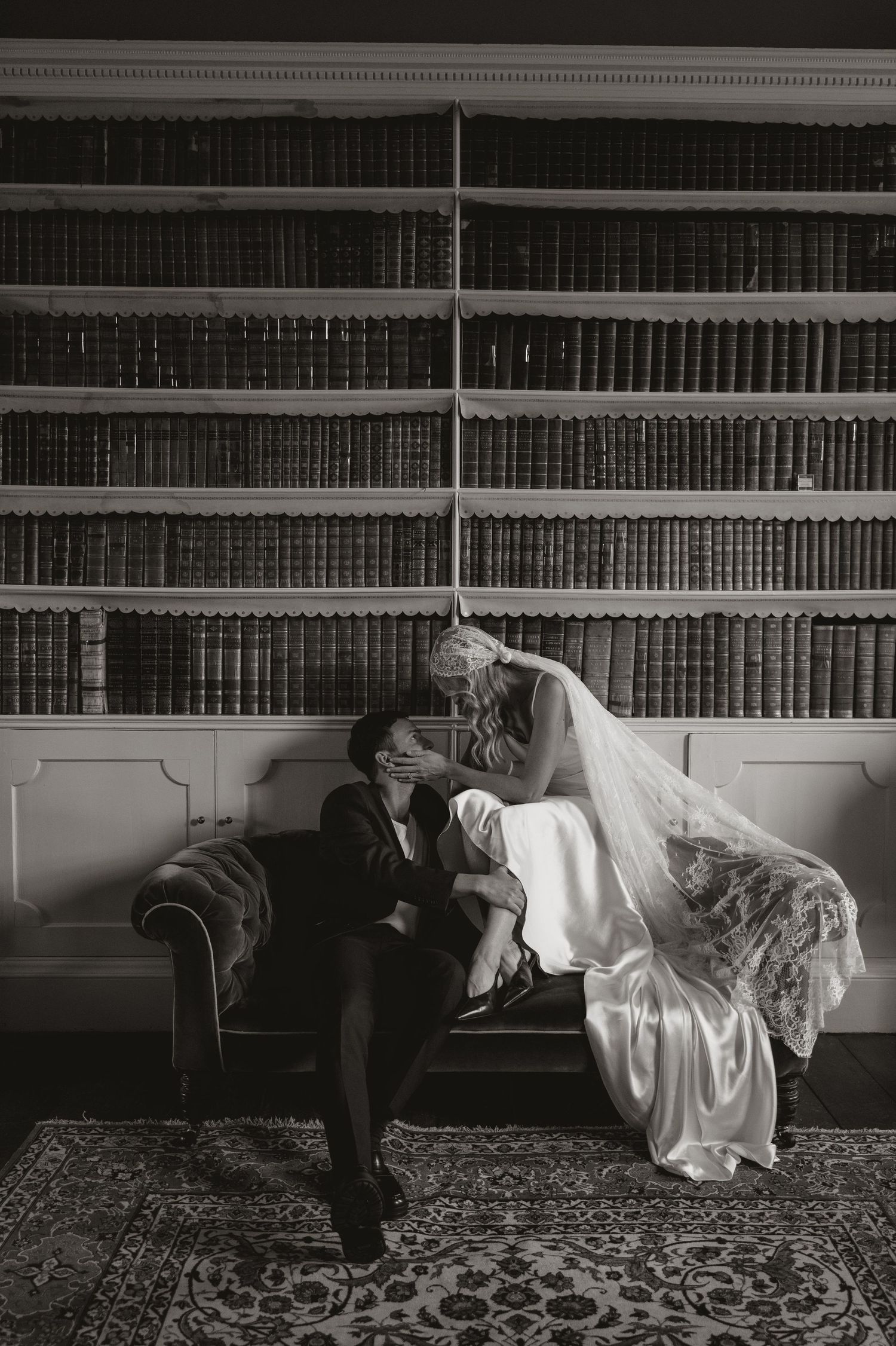 A black and white photo sequence showing a figure in white dress floating horizontally across bookshelves.