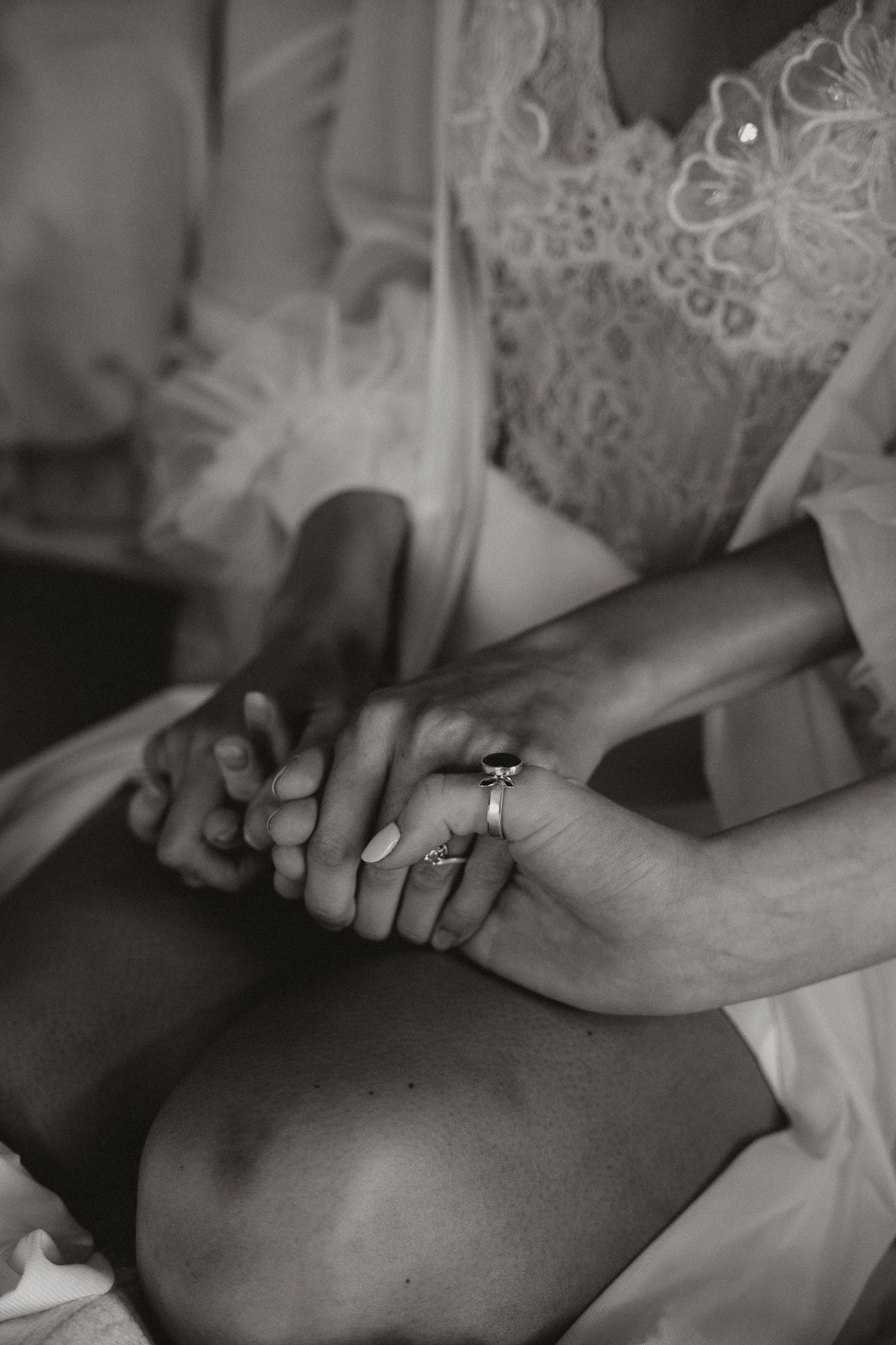 A series of black and white close-up photographs showing hands with wedding rings during a ceremony.
