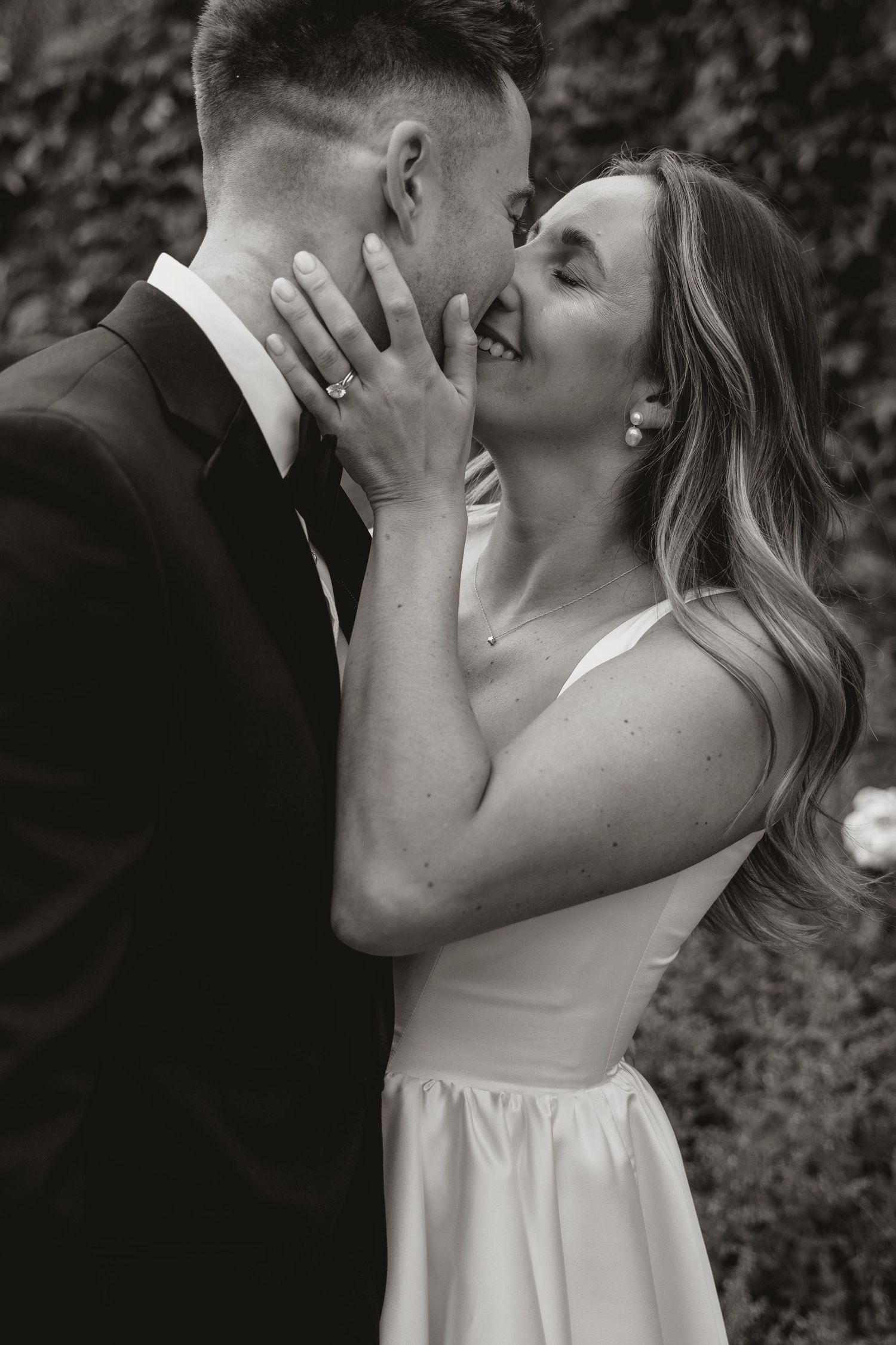 A romantic black and white photo sequence showing tender moments between a couple on their wedding day.