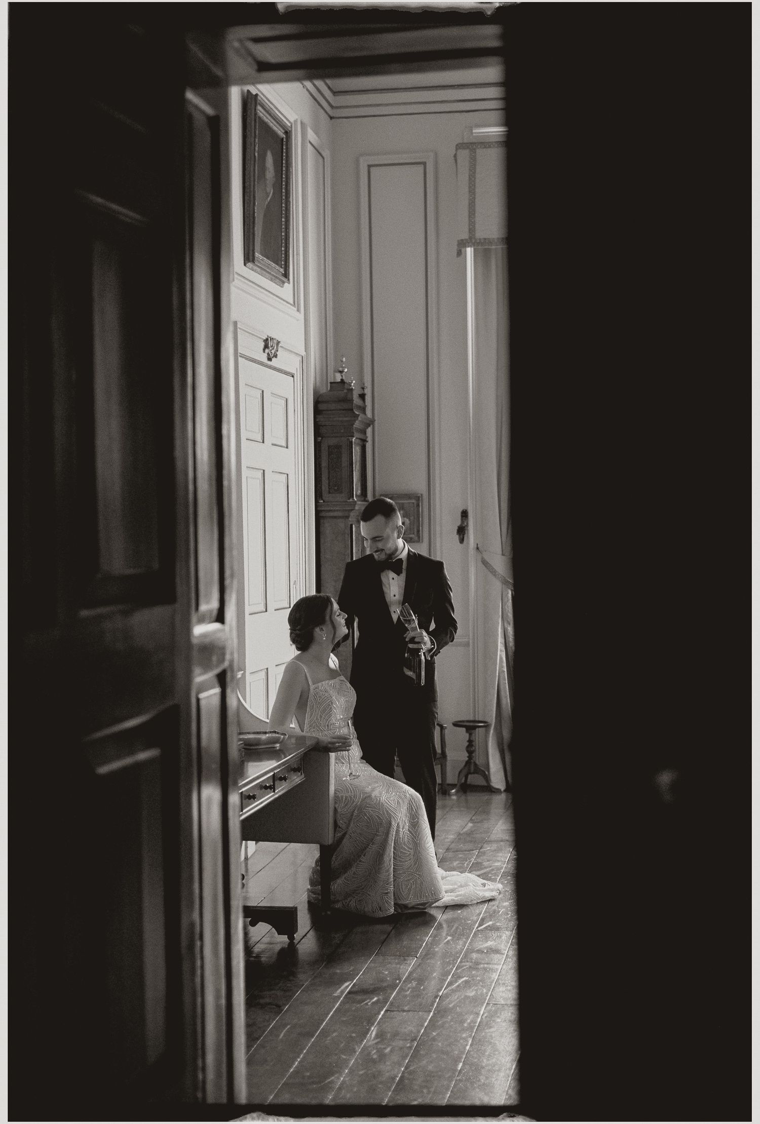 A dramatic black and white photo sequence shows a figure moving through a dimly lit hallway with white doors.