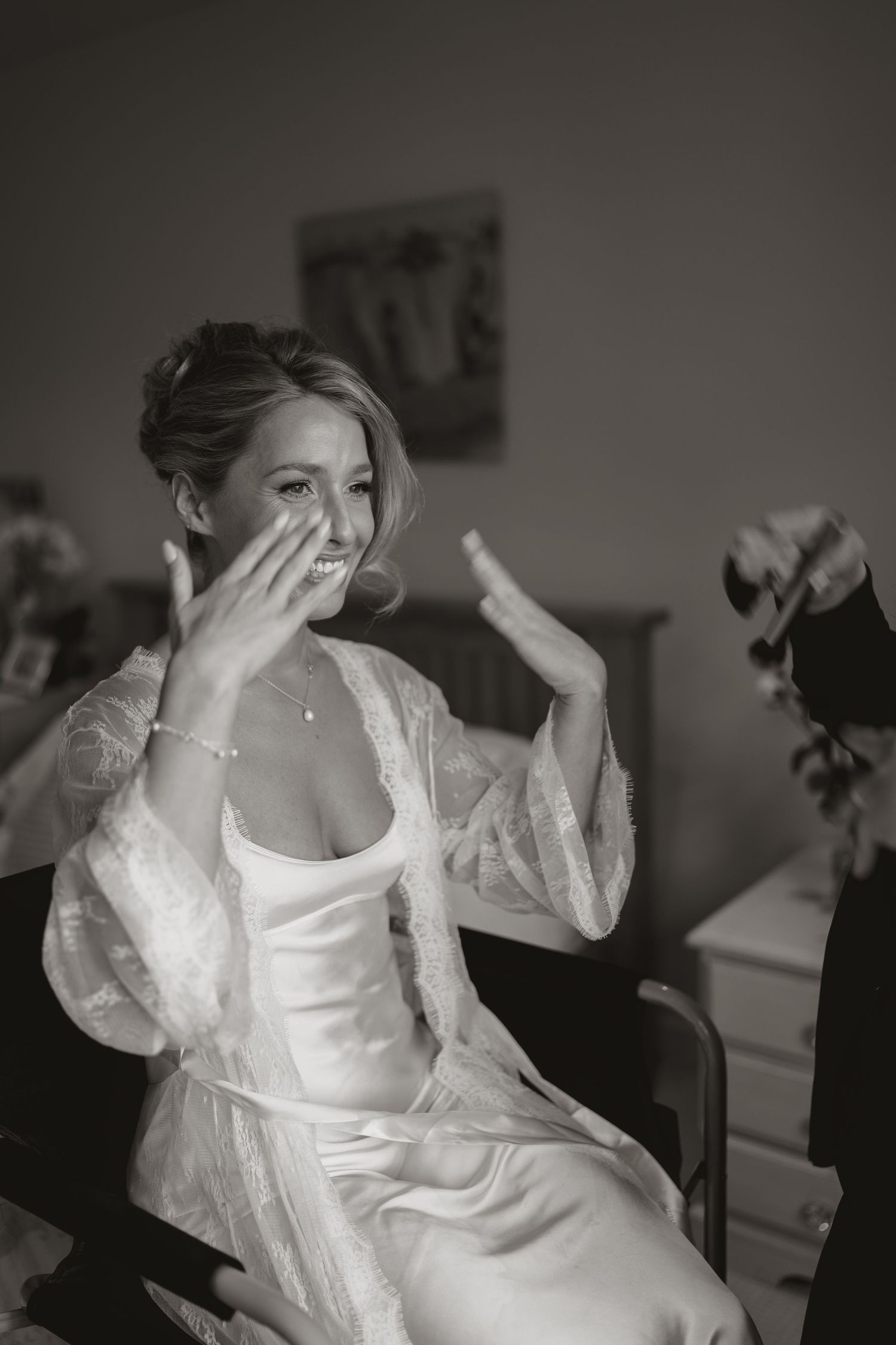 A sequence of black and white photos shows someone in a white dress making playful gestures and expressions.