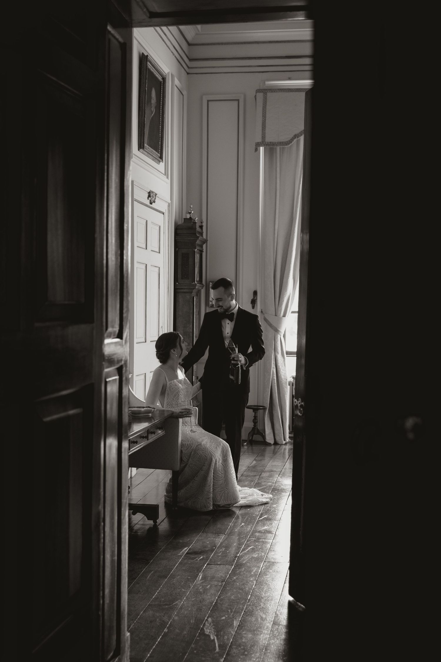 A haunting series of black and white photographs showing dark hallway with silhouettes moving through doorways.