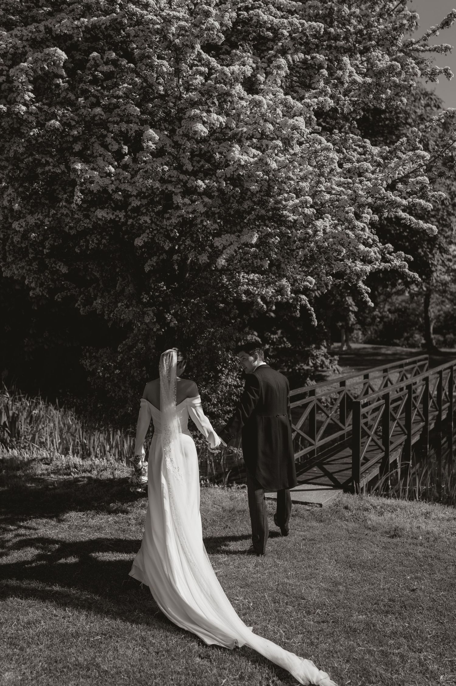 A black and white photo sequence shows a flowing white dress moving gracefully through a garden setting.
