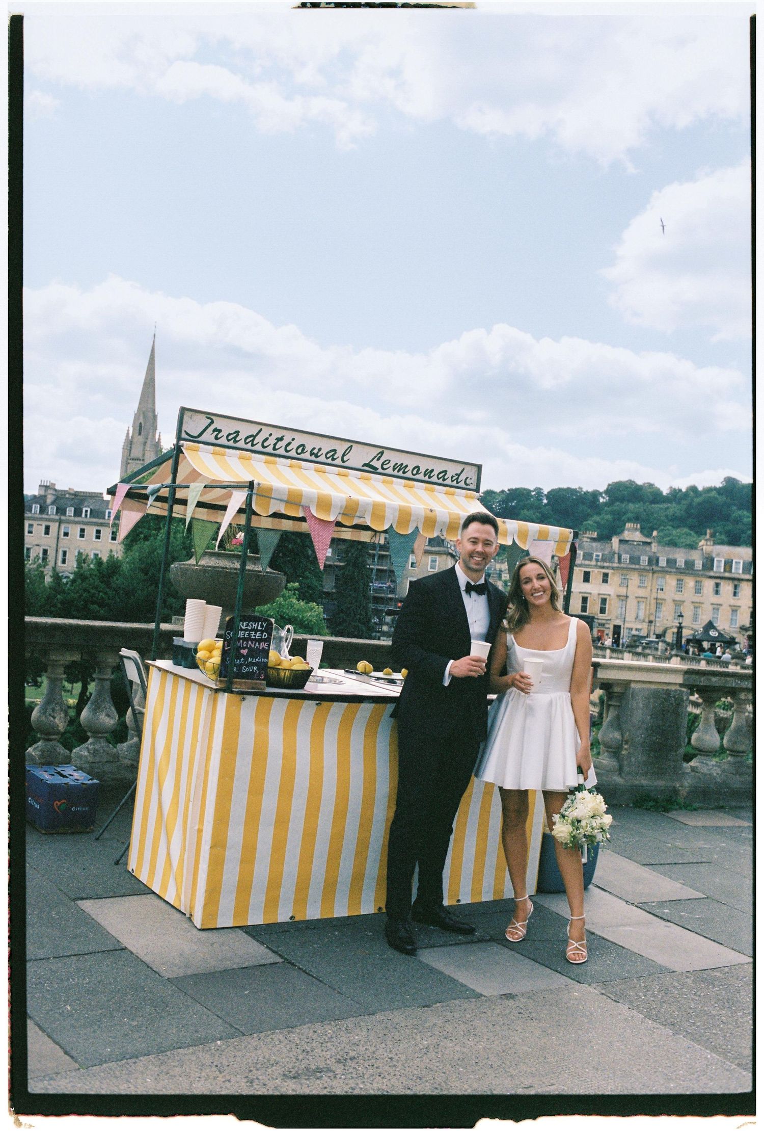 Three similar photos showing a yellow and white striped lemonade stand setup outdoors with people standing behind it.