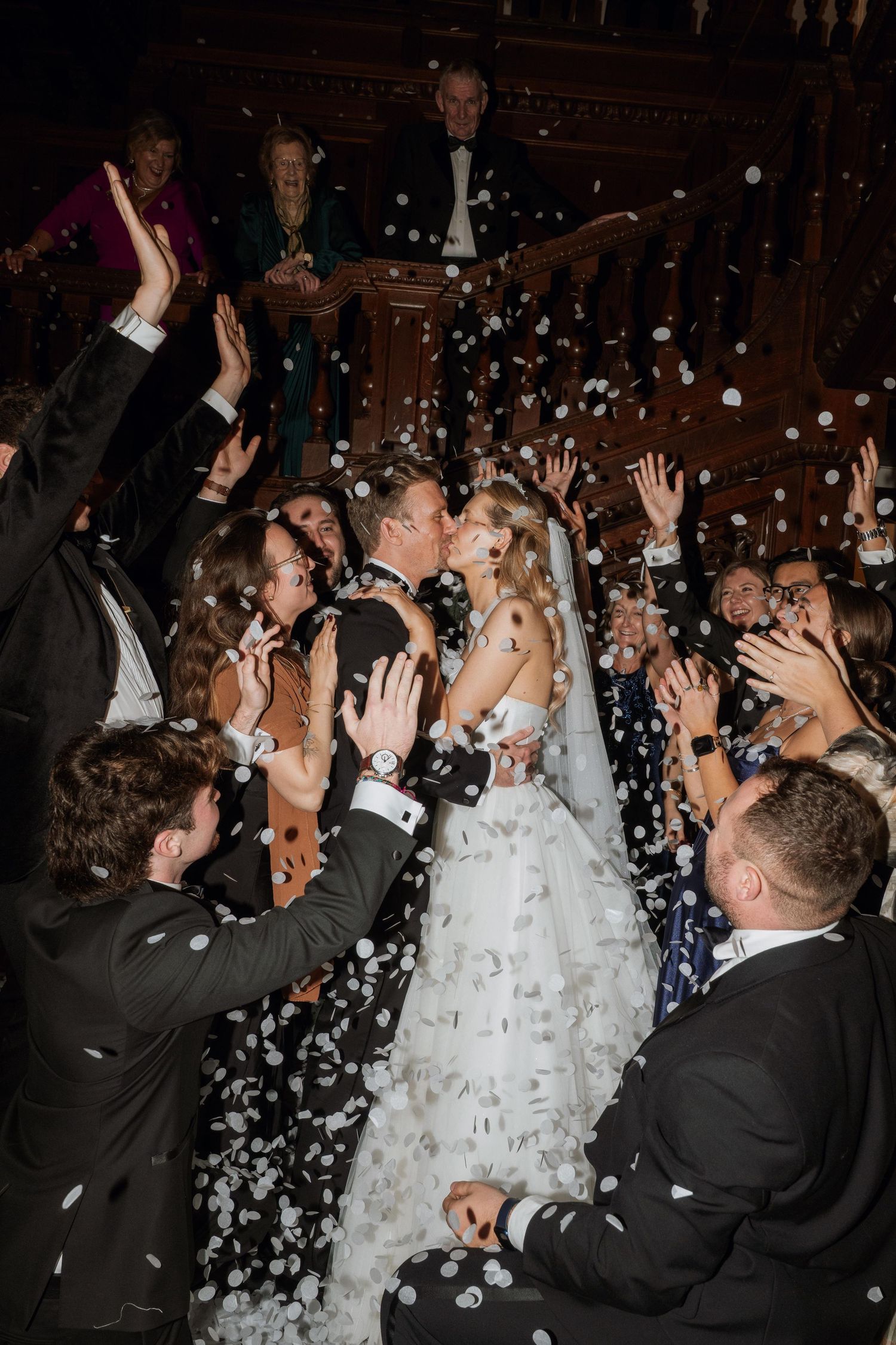 Wedding celebration sequence showing joyful moments with confetti flying through the air during a festive reception.