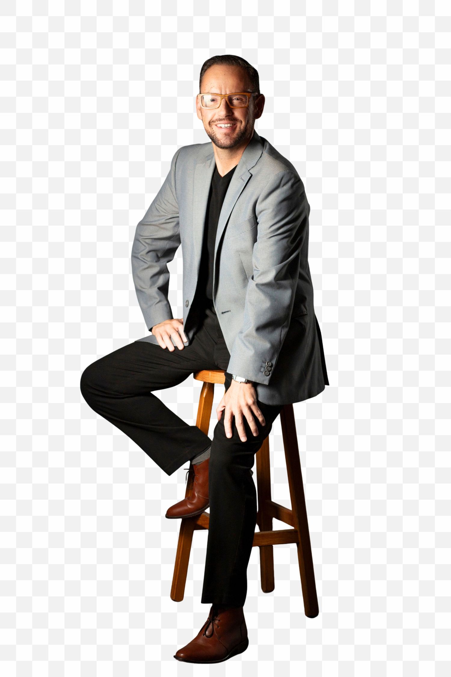 Professional in a gray blazer and black pants sits casually on a wooden stool in three different poses.