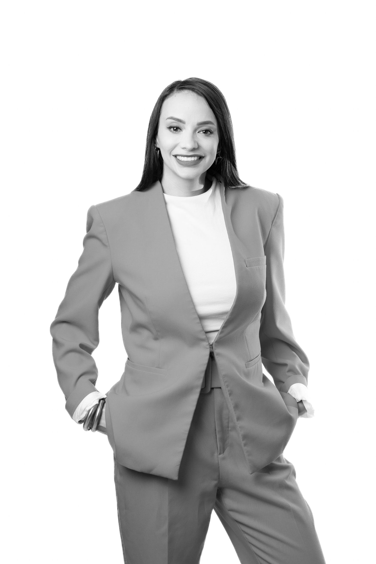 Professional woman in gray business suit and white top poses confidently in multiple dynamic stances.