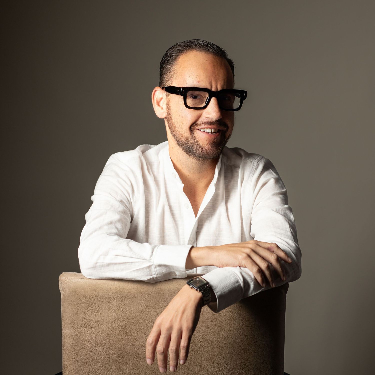 Professional studio portrait series showing a person in a white shirt against a neutral background.