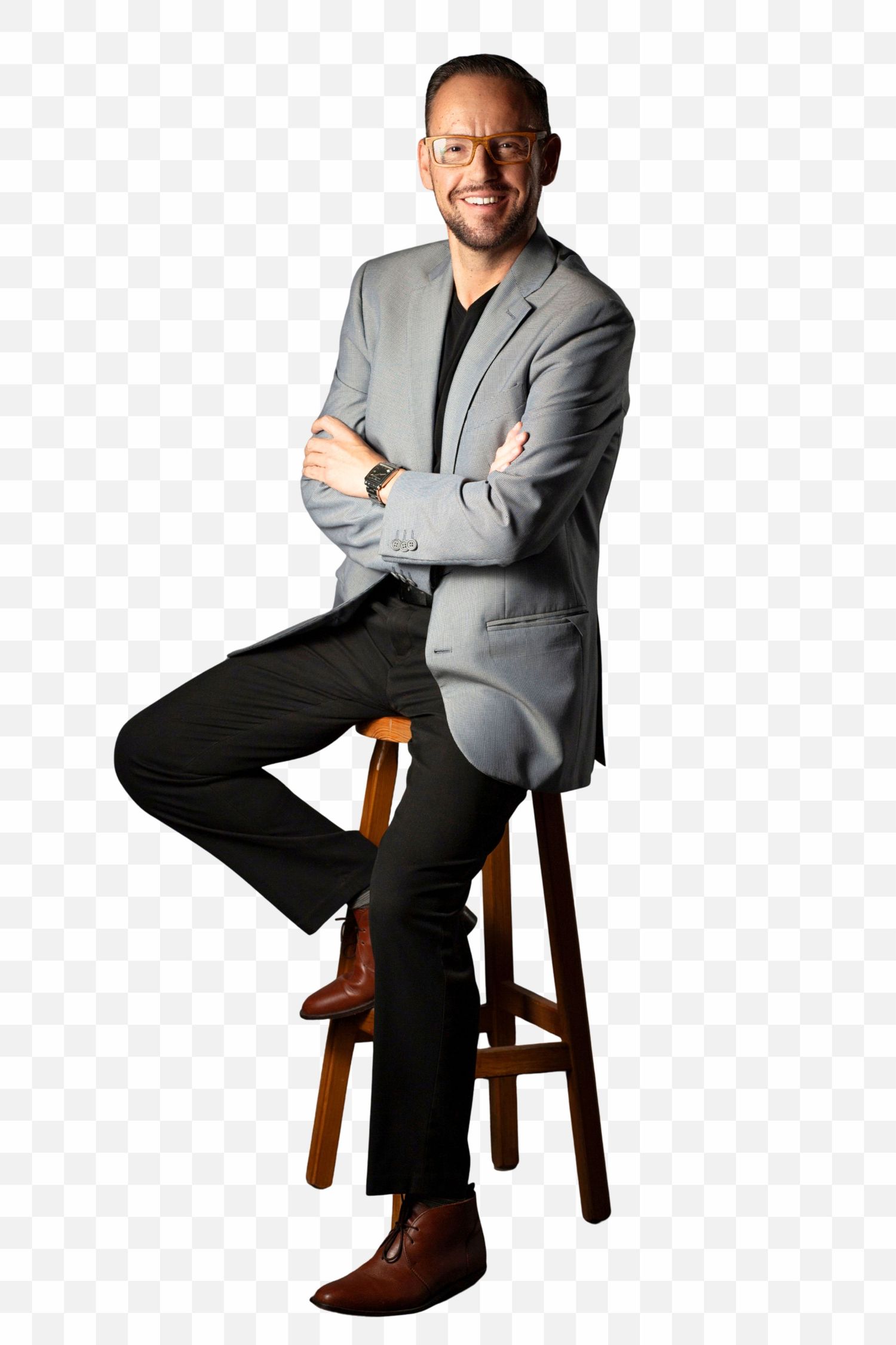 Professional wearing a grey blazer and dark pants sits casually on a wooden stool in three similar poses.