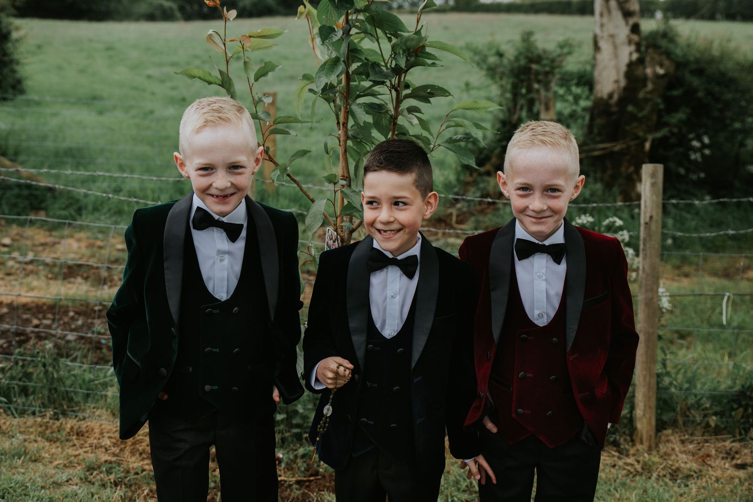 Three brothers in their holy communion outfit