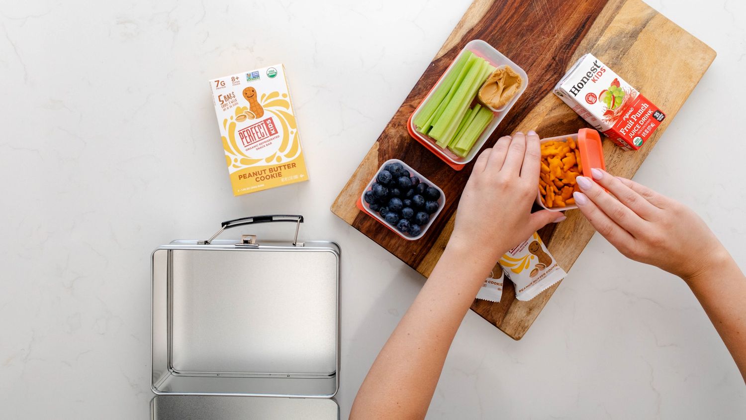 Top down photo of packing healthy lunch with Perfect Snacks Perfect Kids