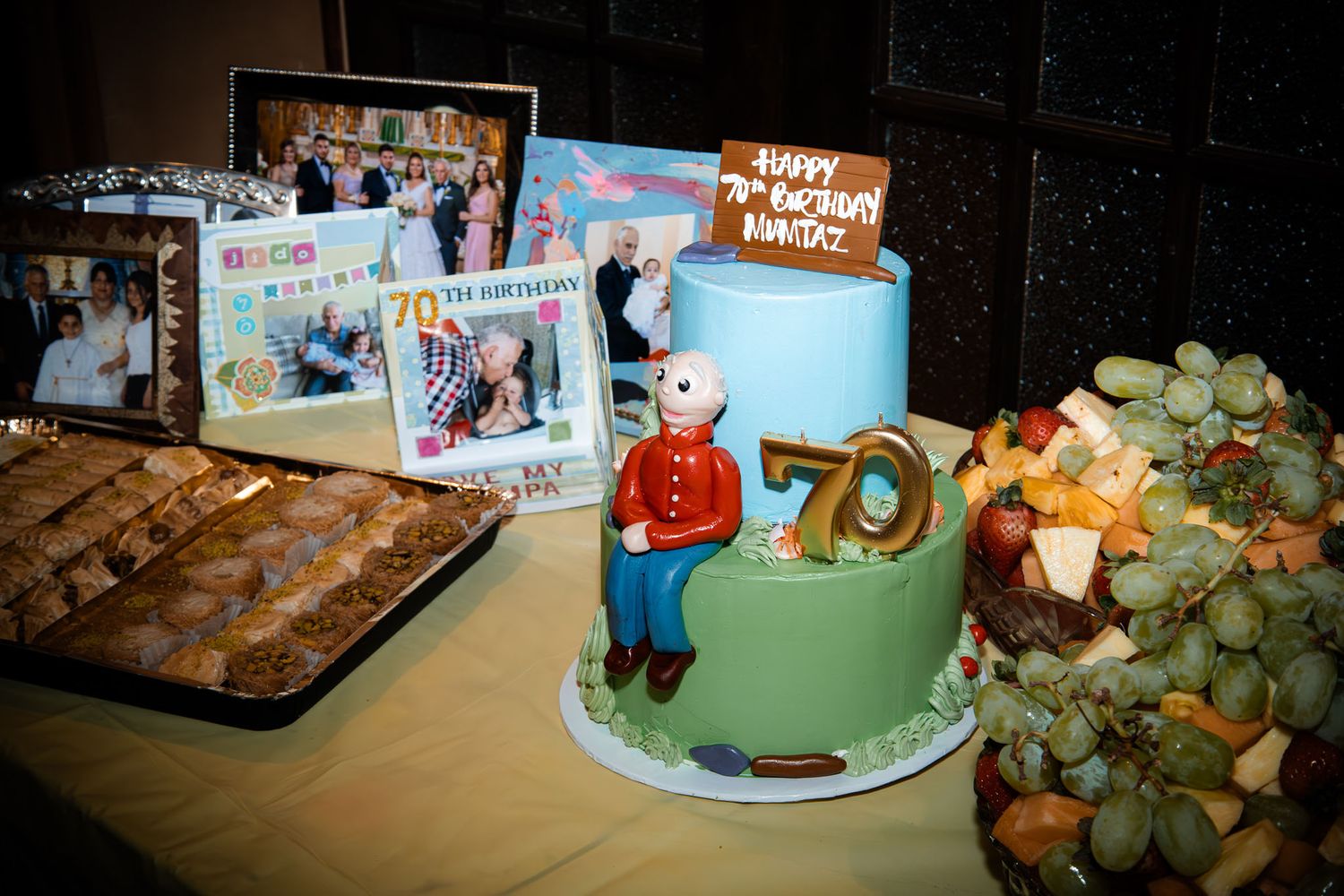 Dessert table and cake for a man's 70th birthday party