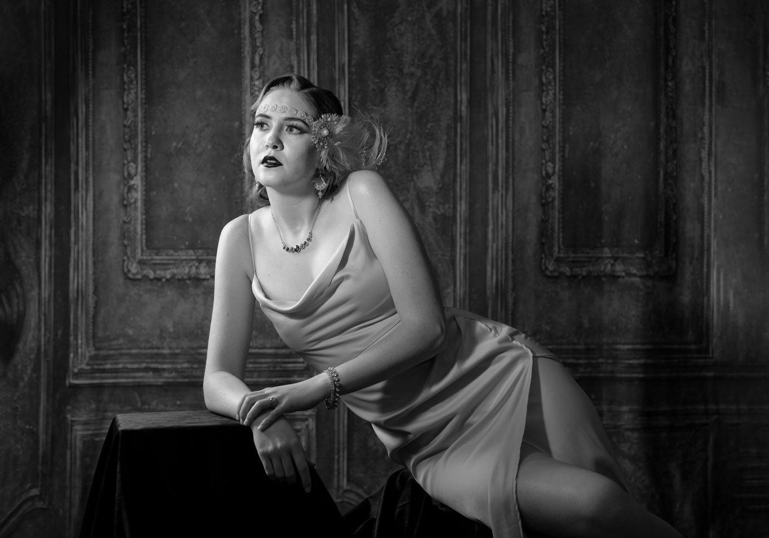 Film noir inspired black and white portraits with dramatic lighting and classic glamour styling.
