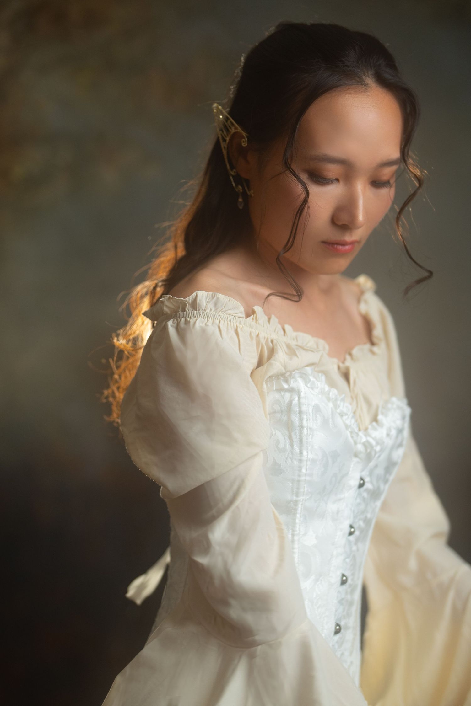 Romantic portrait series in white Victorian-style blouse with soft lighting and dreamy atmosphere.