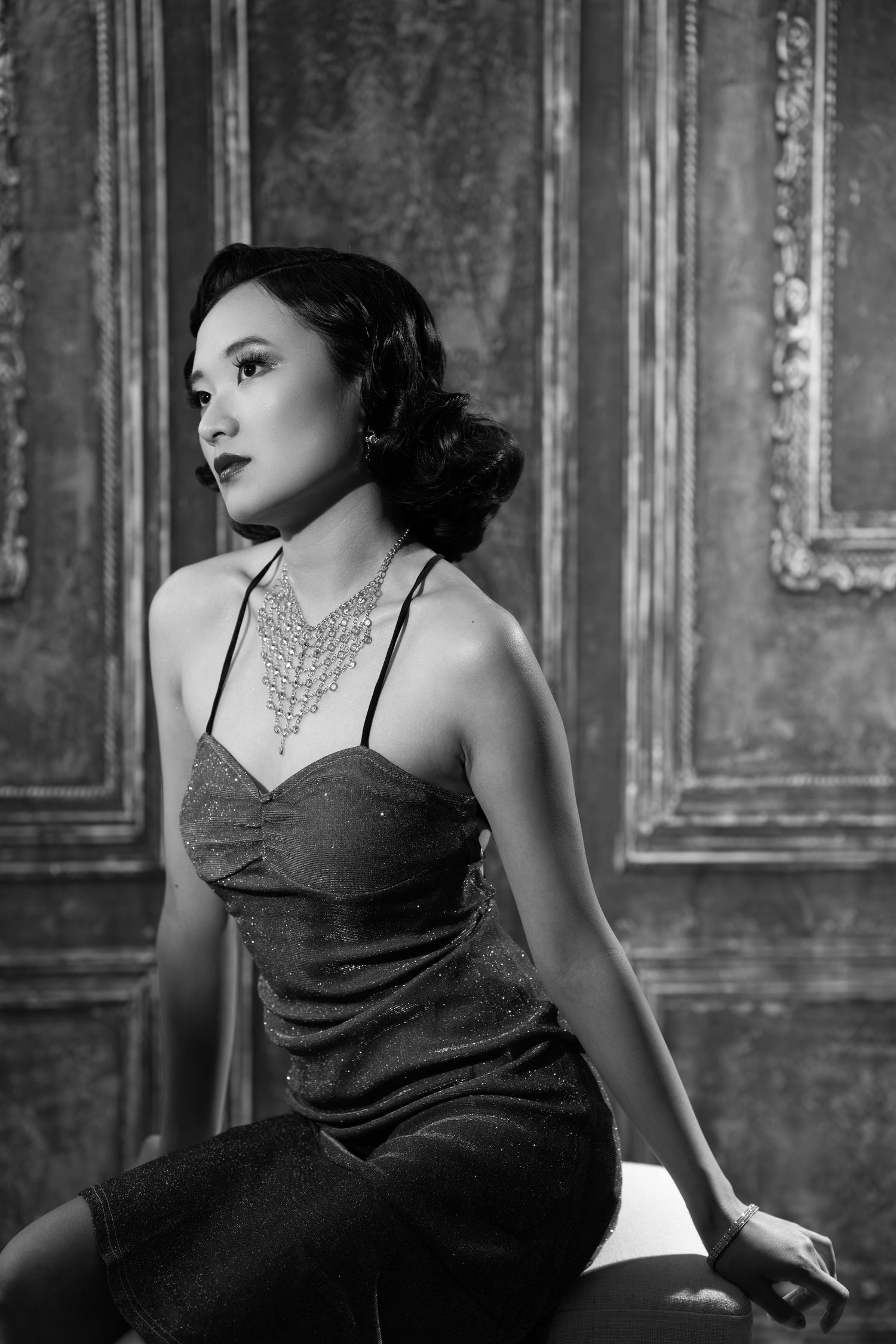Film noir inspired black and white portraits with dramatic lighting and vintage styling.