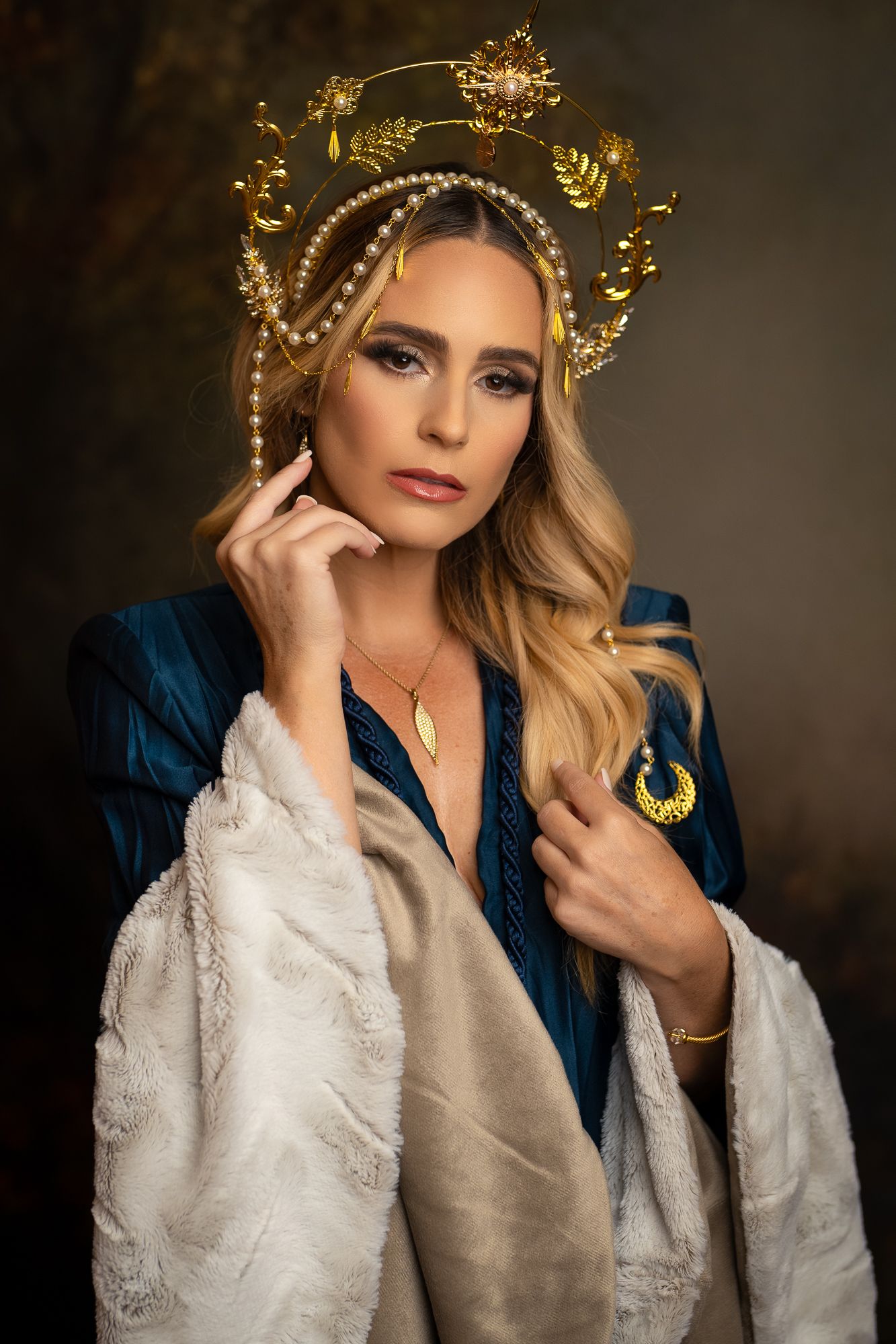 Regal portrait with ornate golden crown and medieval-inspired white and blue dress ensemble.