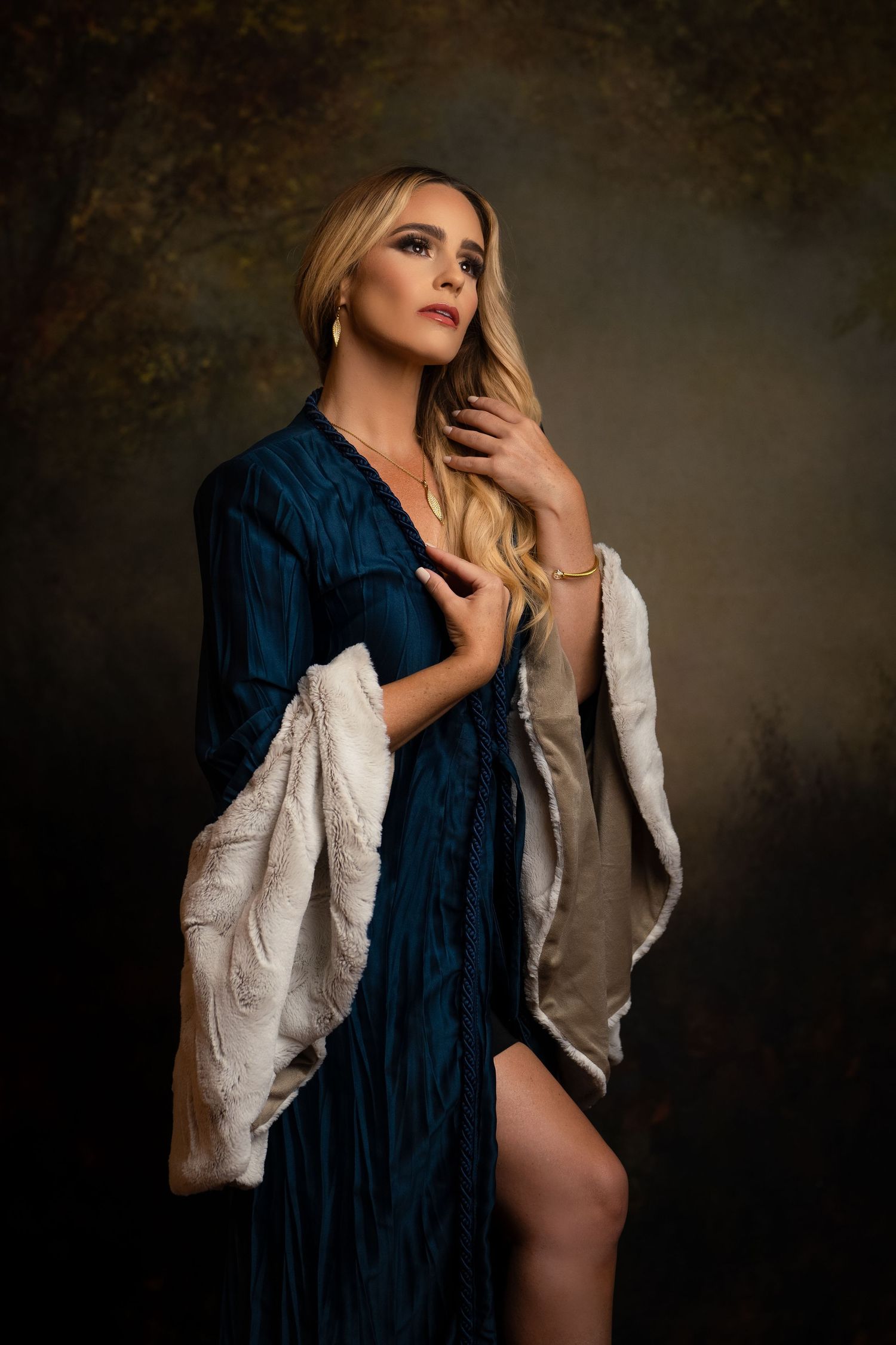 Artistic portrait series featuring dark moody lighting and elegant styling with navy and white clothing.