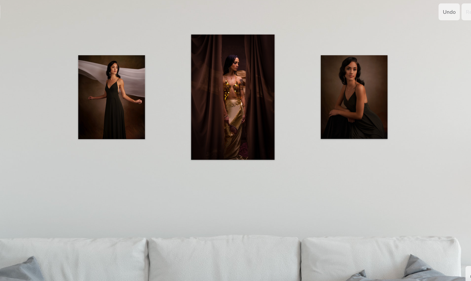 Modern interior design featuring white walls decorated with framed portrait photographs.