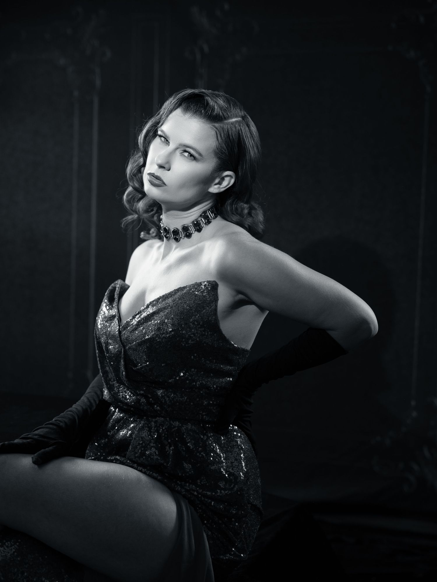 Film noir inspired black and white boudoir series with dramatic shadows and vintage aesthetic.