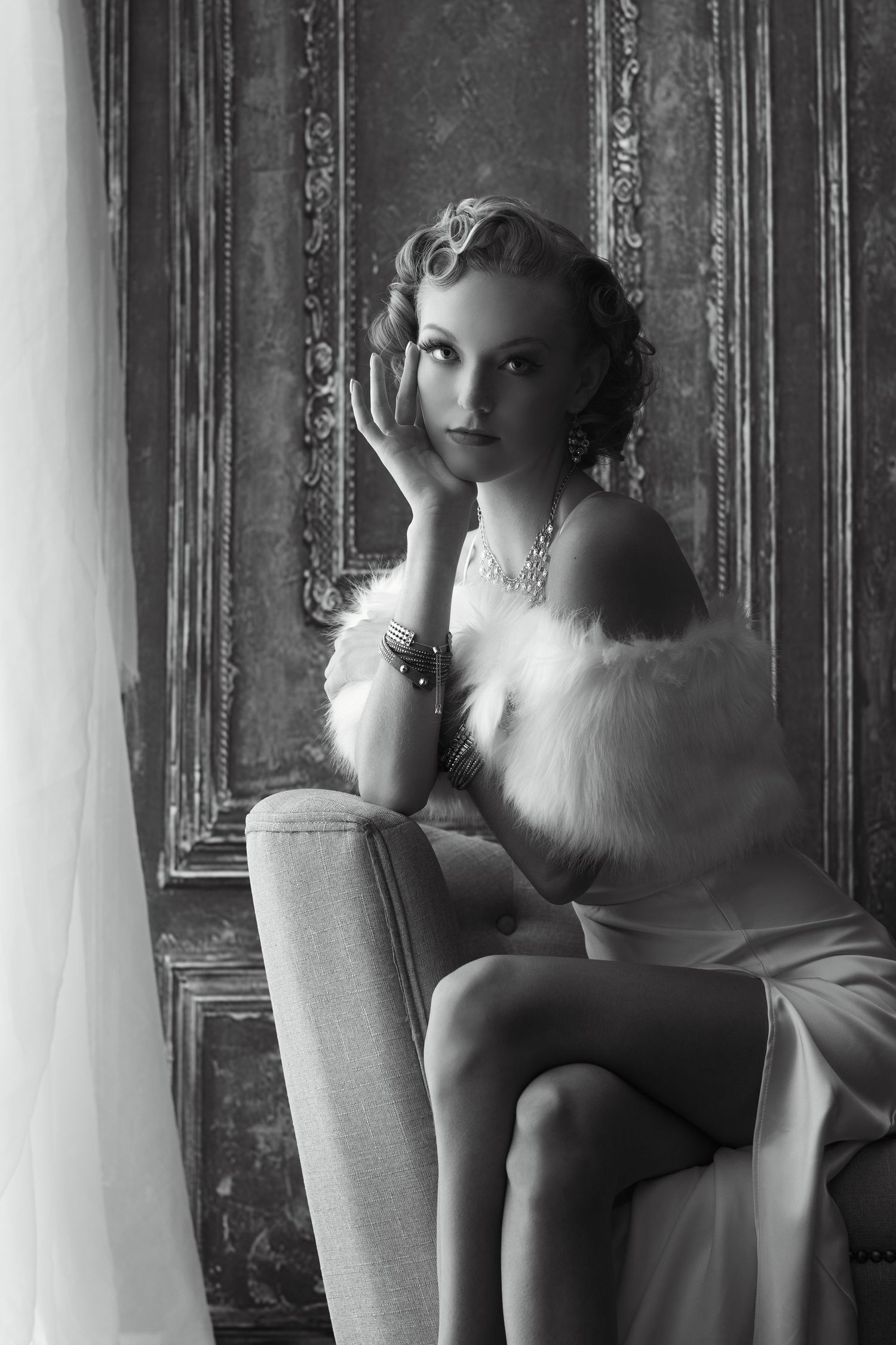 Film noir inspired black and white portrait series with dramatic lighting and vintage styling.