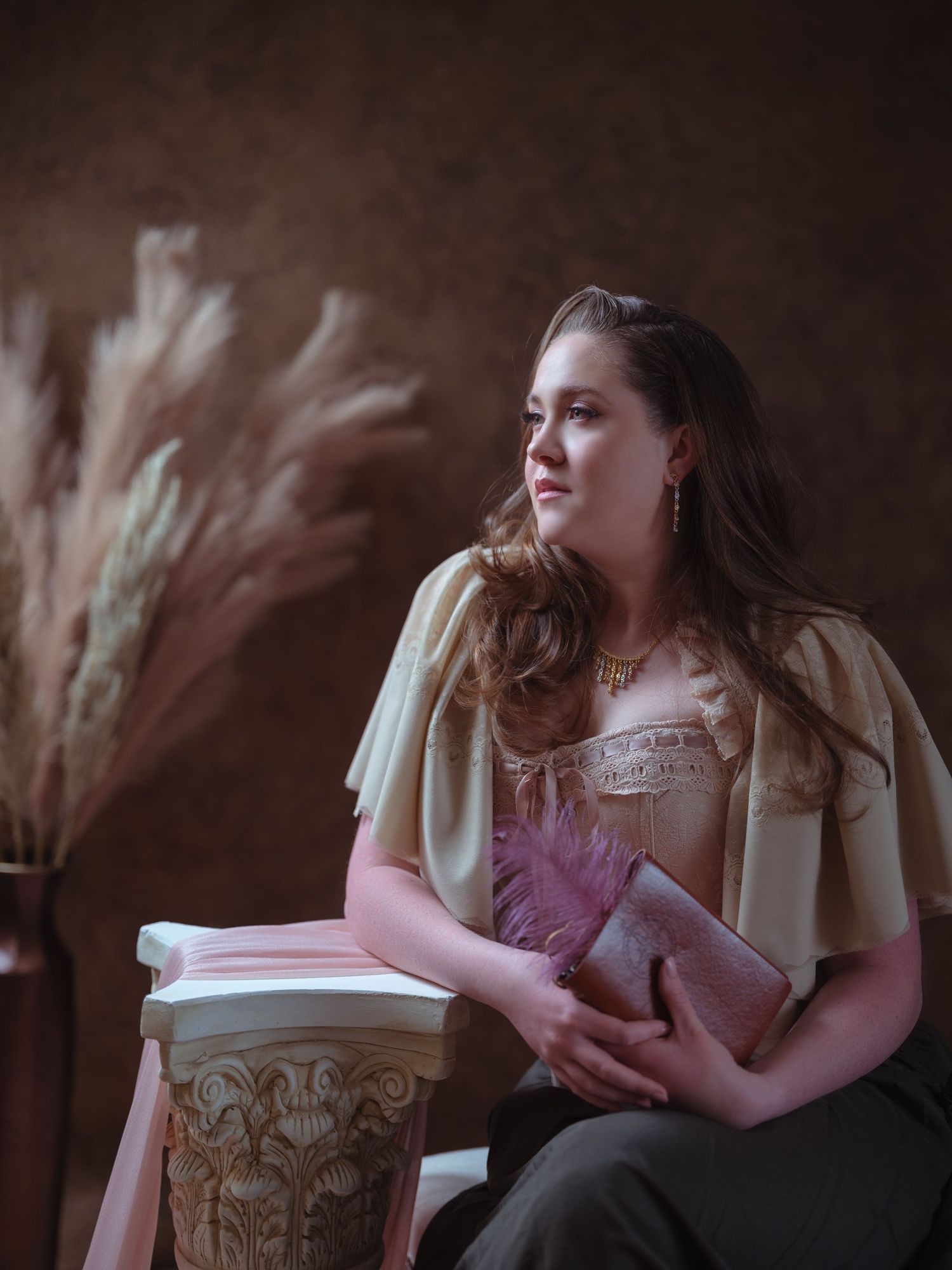 Intimate portrait session featuring ornate furniture and soft lighting.